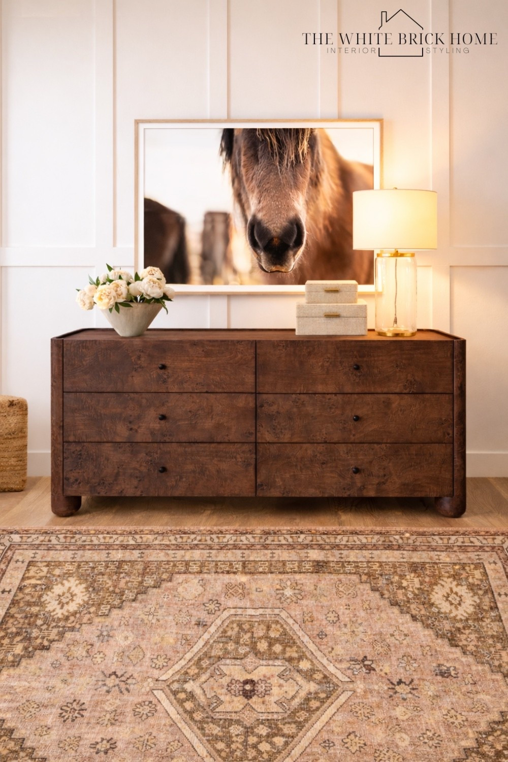 A dresser and decor idea where warm wood tones, soft lighting, and beautiful photography come together to create a textural, elevated corner of a bedroom. 
🖤🖤
Bed, bedroom, bedroom dresser, bedroom furniture, bedroom decor, area rug, bedroom rug, table lamp, wall art, faux greenery, ottoman, decor box, bedroom design ideas, bedroom lighting, pottery barn, west elm, McGee and co 


#LTKSaleAlert #LTKHome #LTKSeasonal