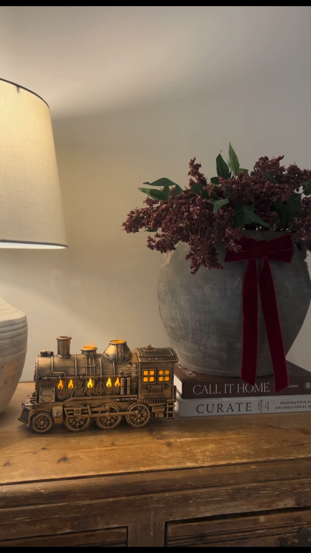 @littleredcolonial 

Christmas decor. Train decor. Christmas train. Christmas stems. Christmas bows. Burgundy . Interior design books. Coffee table books. Vase. Vessel. Diffuser. Lamp. Table lamp.