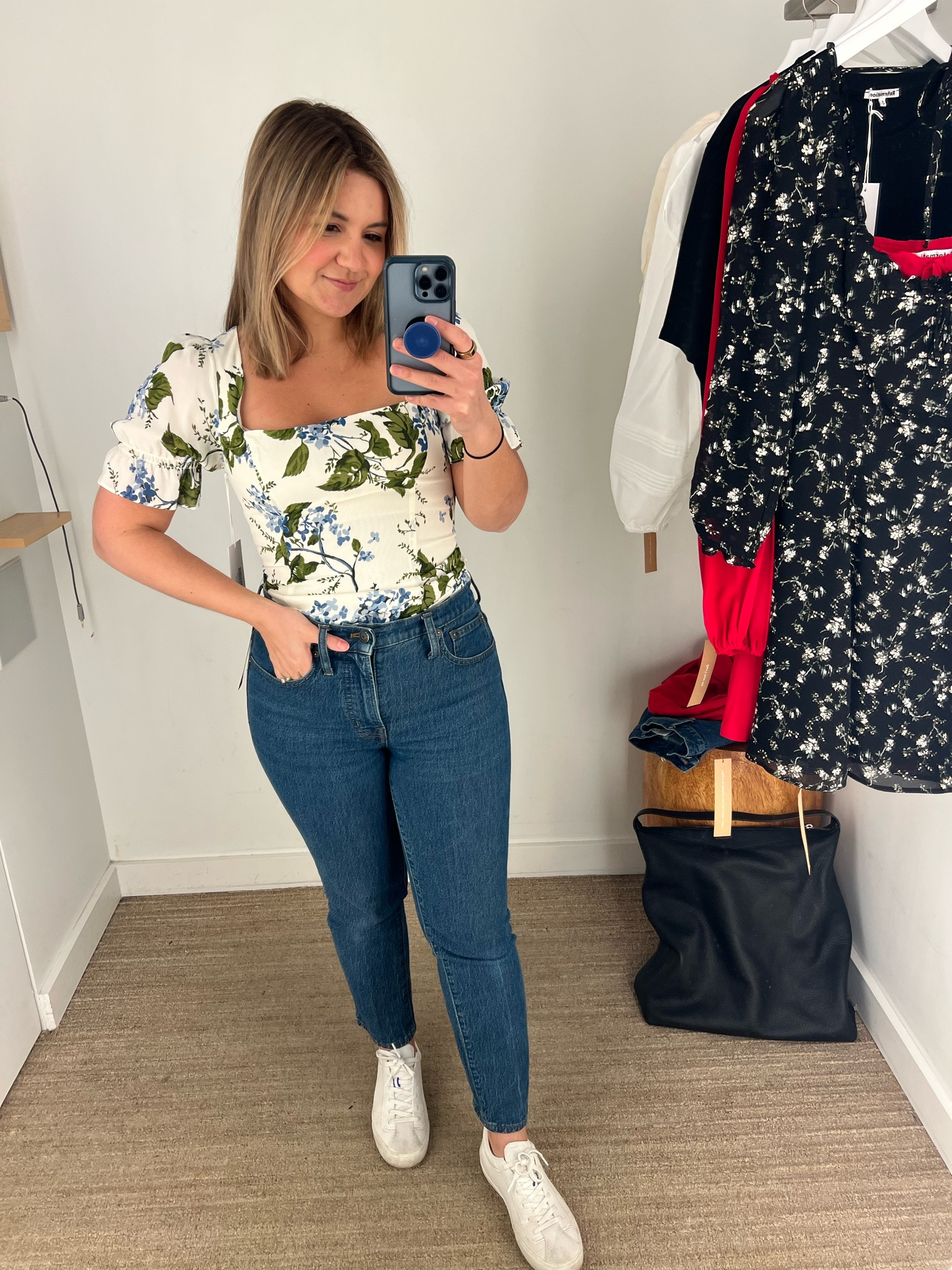 This top runs a little small but it is SO cute! I am wearing a size 4.