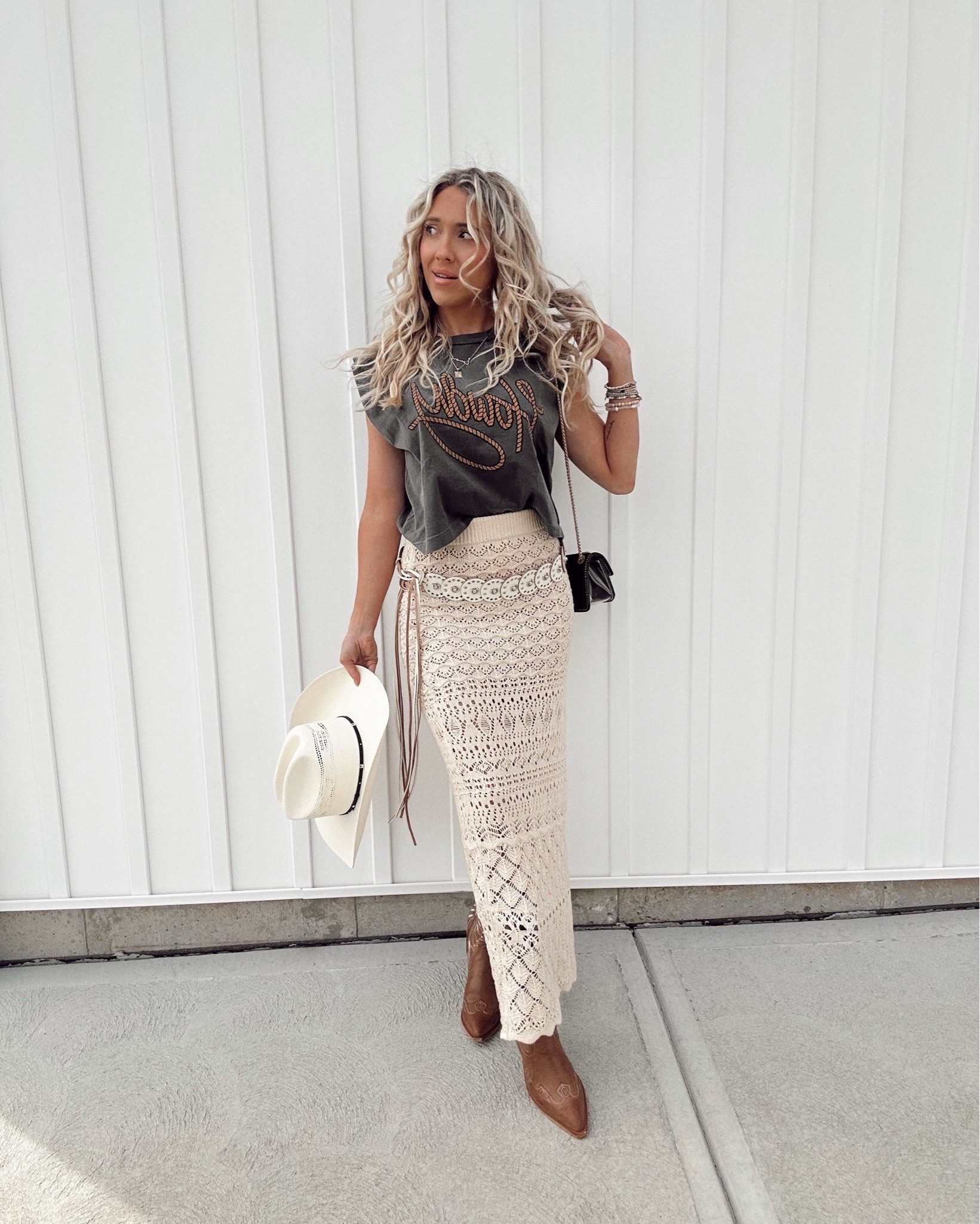 Loving this knit skirt skirt paired with a graphic Tshirt “howdy” 🤠 from @VICI - Code “KERSTYNSAVE35” for 35% anything sitewide at vici! 💕💕💕 
Festival look, costal Cowgirl, western style, cowgirl boots fit #LTKFindsUnder100


#LTKFestival #LTKootd #LTKSpringSale