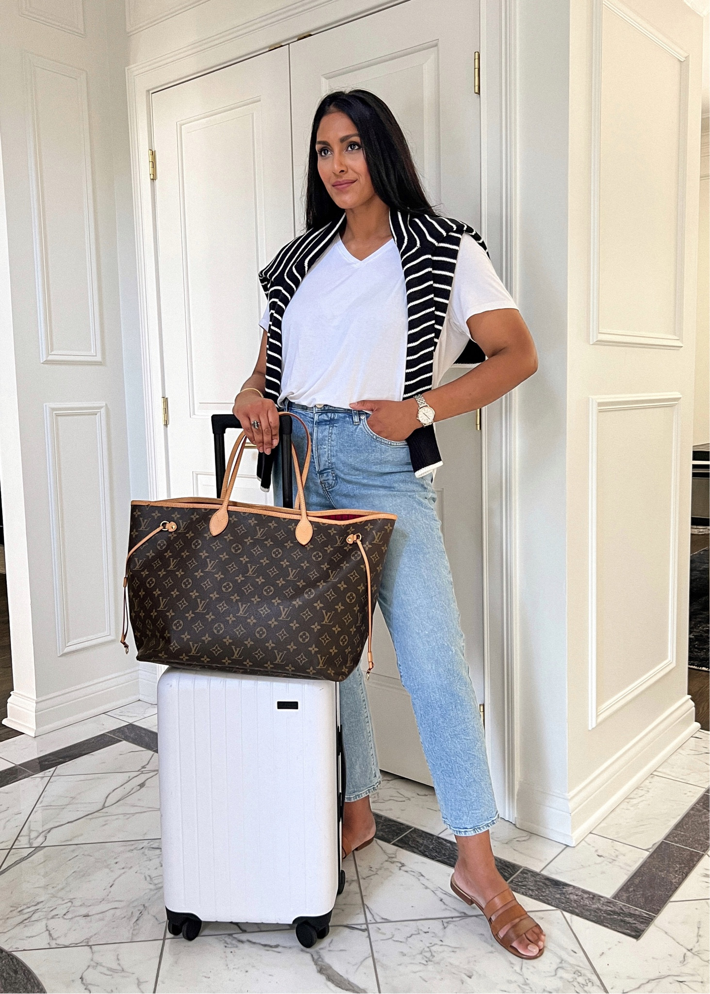 Travel outfit inspo. Stripped sweater, white tee, mom jeans. 

#LTKunder50 #LTKtravel #LTKstyletip