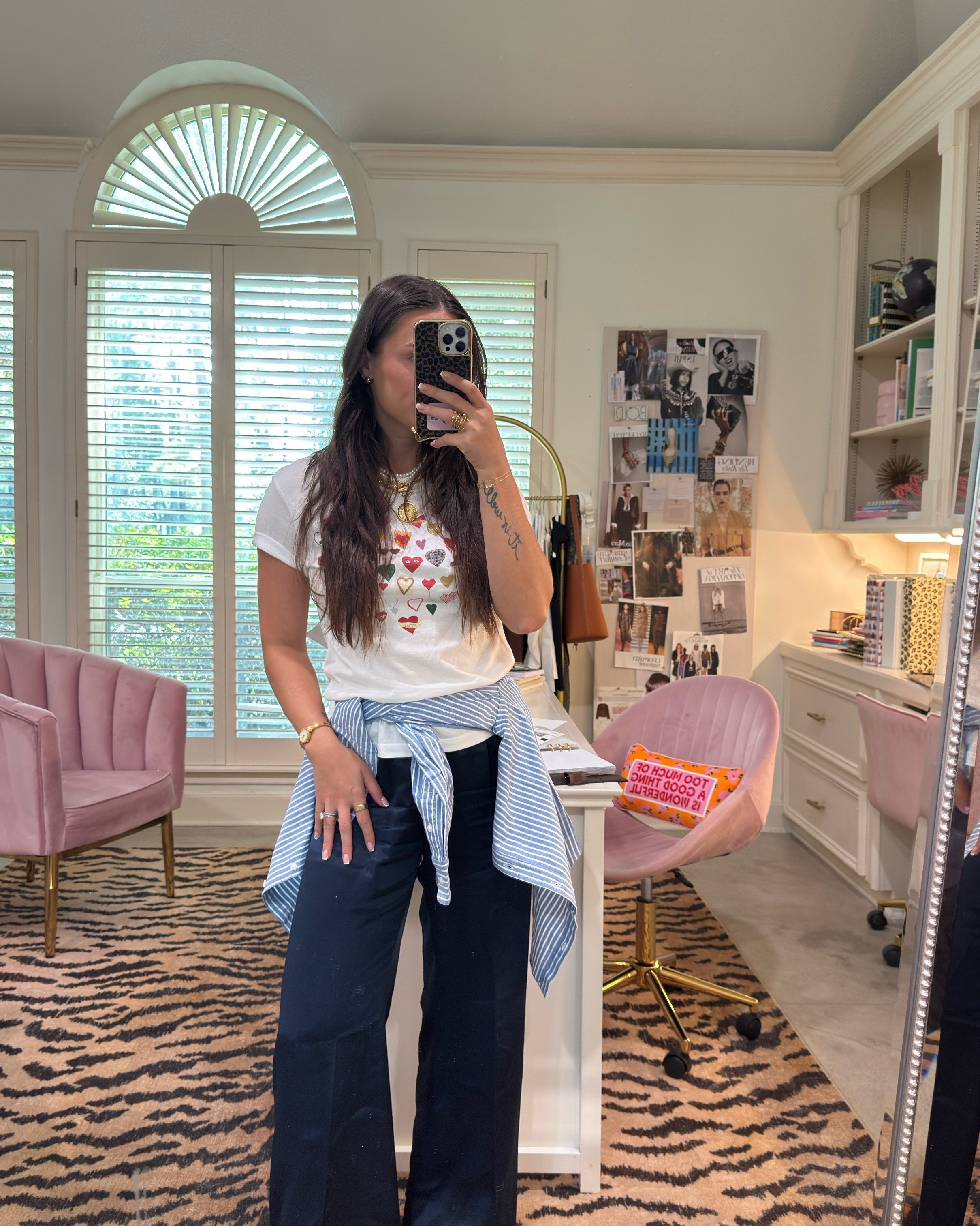 A graphic tee has no business looking this polished. That's the whole trick.

Satin wide leg does the heavy lifting, the striped button down tied at the waist gives you shape without trying, and red flats keep the whole thing from taking itself too seriously. Pearls AND the coin chain. Yes, both. Gold watch, stacked ring, and you're out the door looking like you planned it. 

 #LTKootd