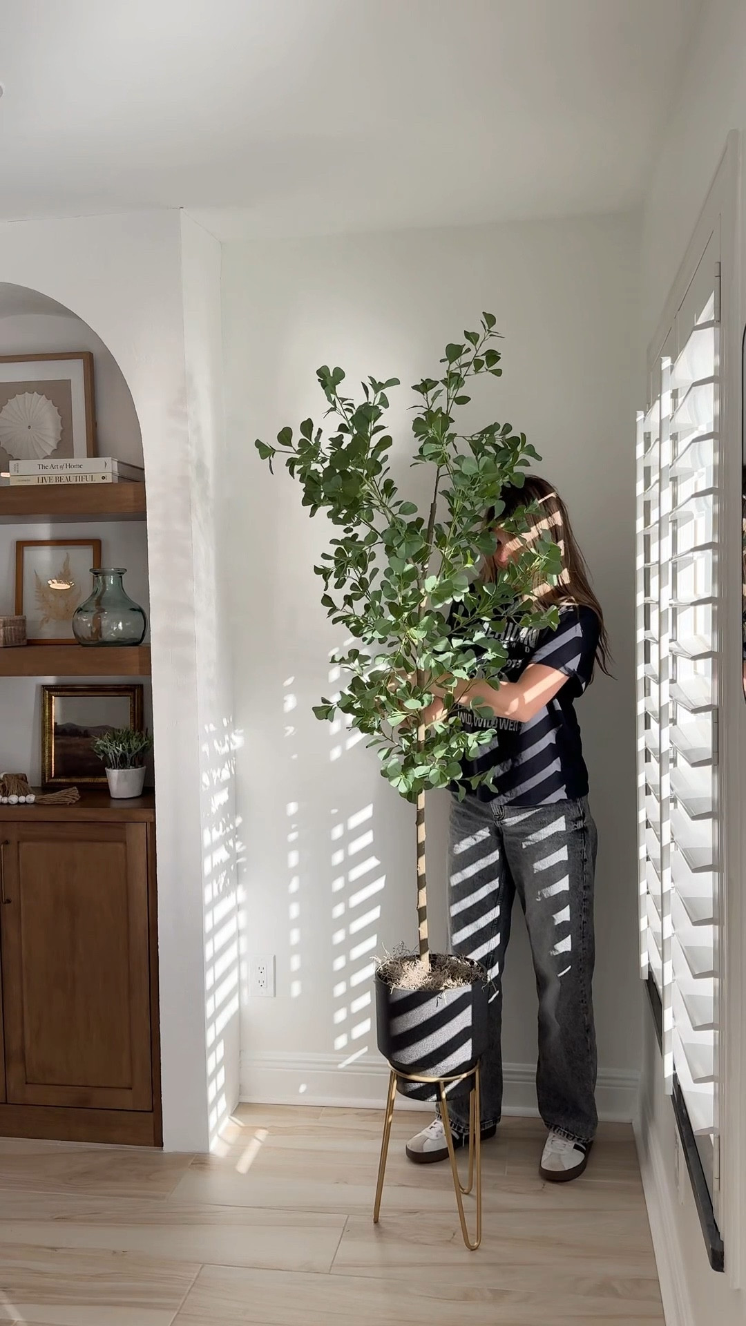 If a corner feels awkward or unfinished, don’t force furniture. Add height instead. A tall faux plant instantly fills the space and makes the room feel styled, without clutter.

#LTKFindsUnder100 #LTKHome #LTKSaleAlert