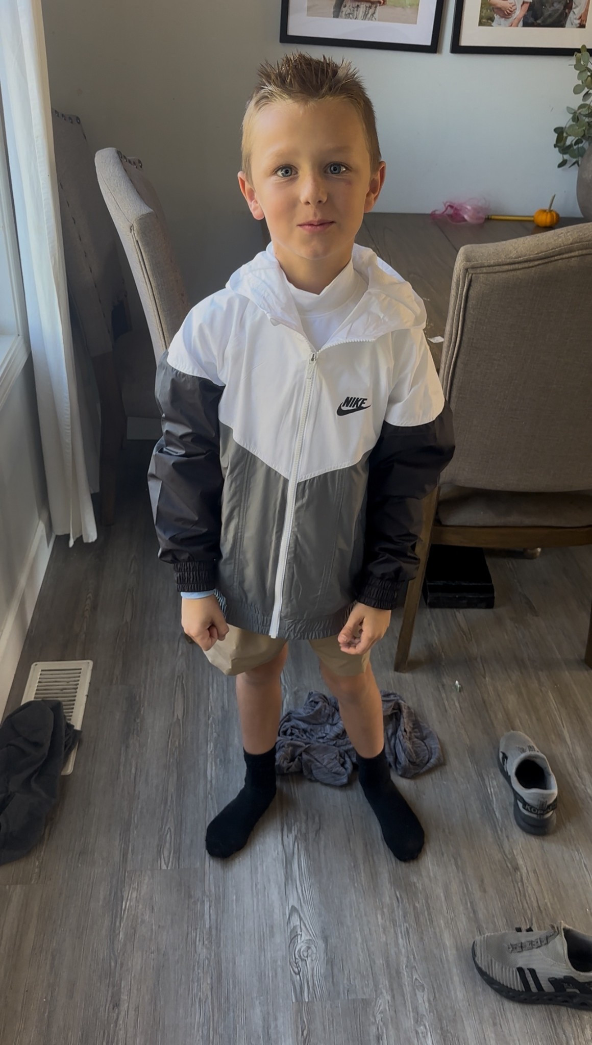 This Nike shell jacket will keep my son warm and blocked by wind for cold runningg