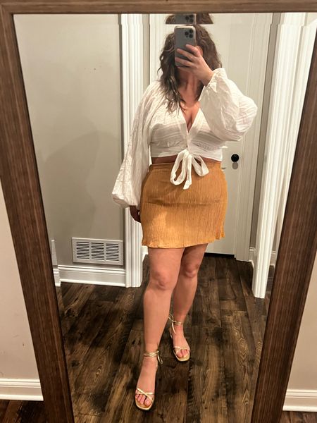 An outfit I loved but forgot to photograph while in Cabo. I love a tie front top. Also a sustainable brand mini in a soft bamboo? Sign me up! The skirt runs large so size down if in between. I’m in an XXL but had to tailor it a bit. Cannot stress how much I wear these Margaux wrap sandals. Also check out the Amazon version and the plus size option similar to skirt I linked too. 

#LTKunder50 #LTKcurves #LTKtravel