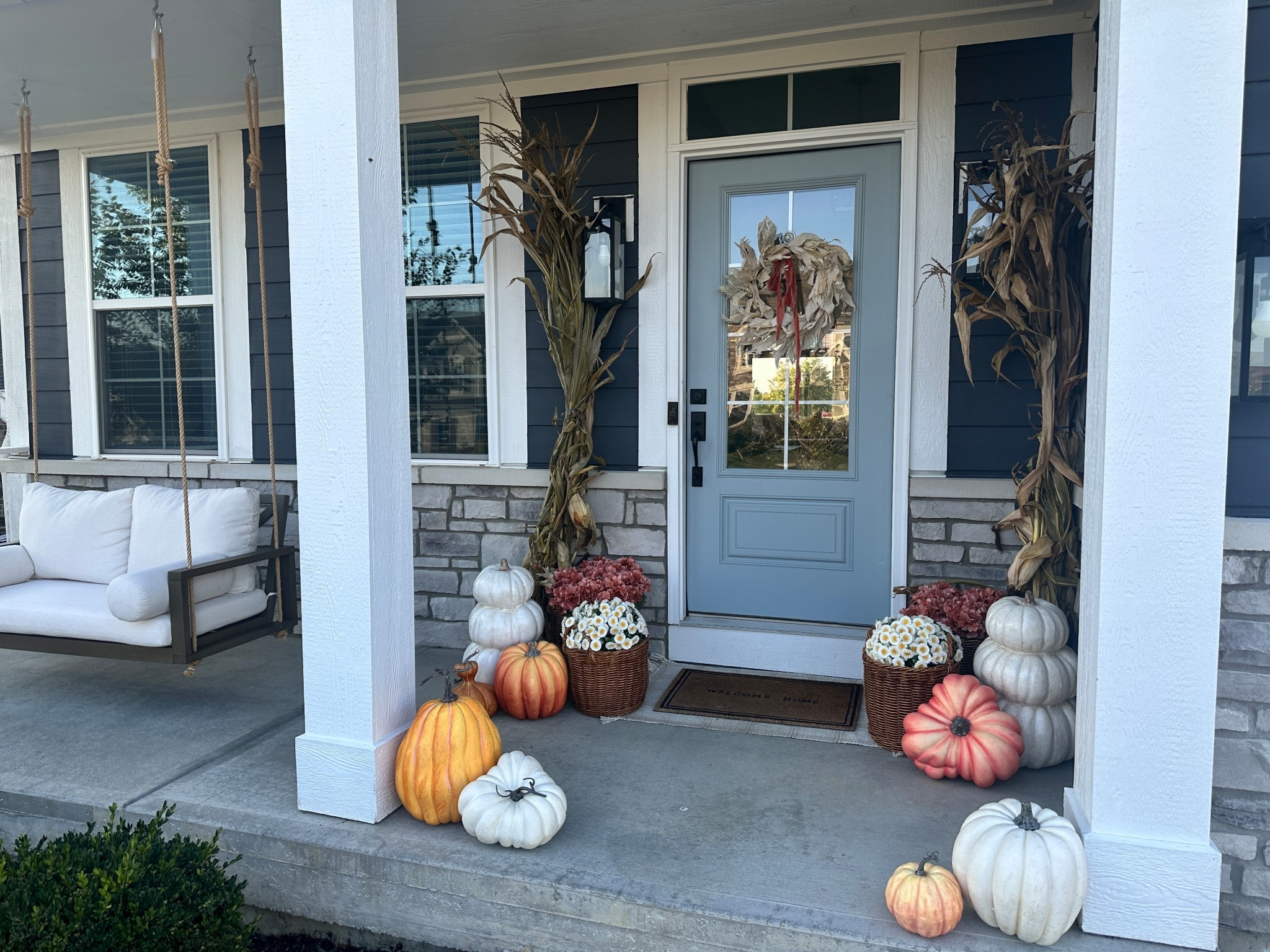 Fall front porch, faux pumpkins, faux mums, porch decor 

#LTKHalloween #LTKHome #LTKSeasonal