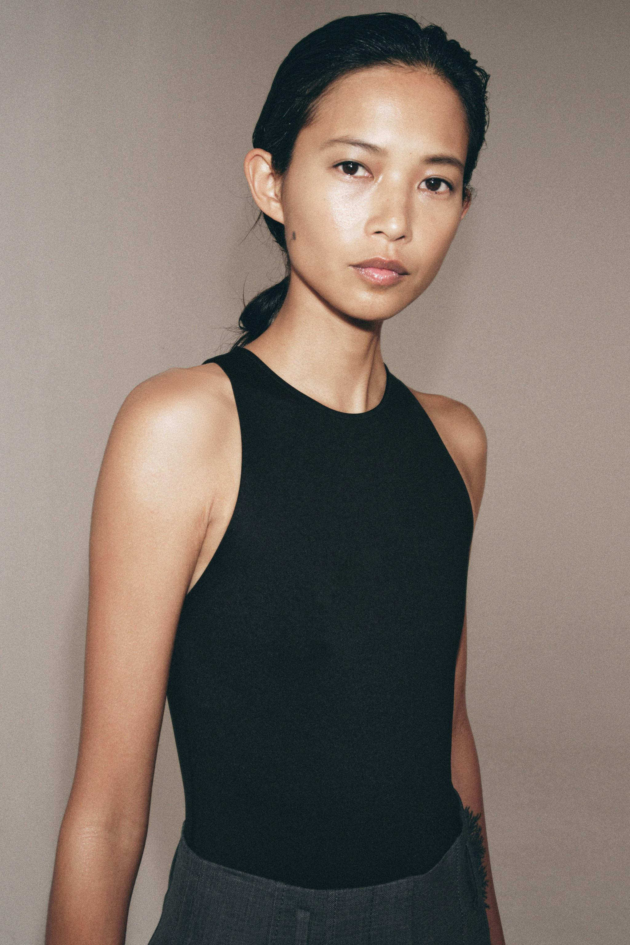 Halter neck bodysuit made of polyamide blend yarn. Bottom snap button closure. | Zara US