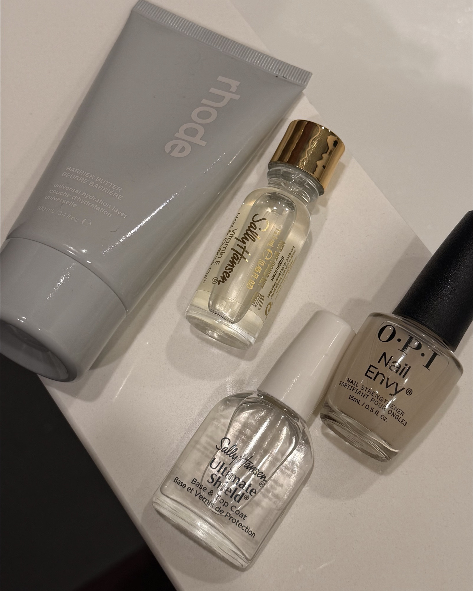 Growing out my natural nails & recovering from years of gel. Kind of crazy you can see where my new nail bed is growing in!
Cuticle oil 3x a day sometimes more 
Nail envy - 2 coats day 1, 1 coat every day for 7 days 
Rhode hand cream after cuticle oil to seal it 
