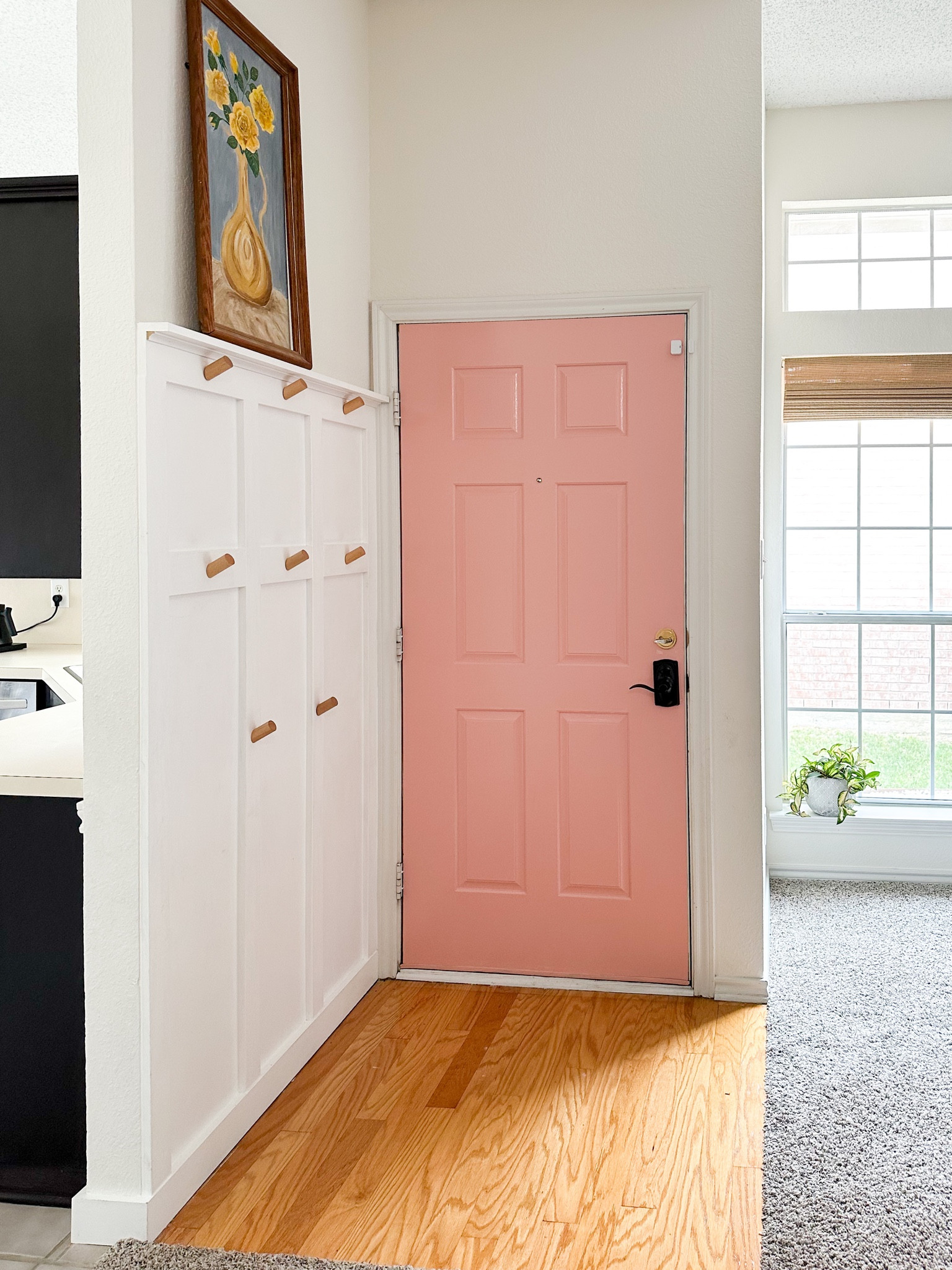 Pink front door in our Texas house with a board and batten drop zone for all our kids things. We didn’t have a front closet, so this helped so much! 



#LTKhome