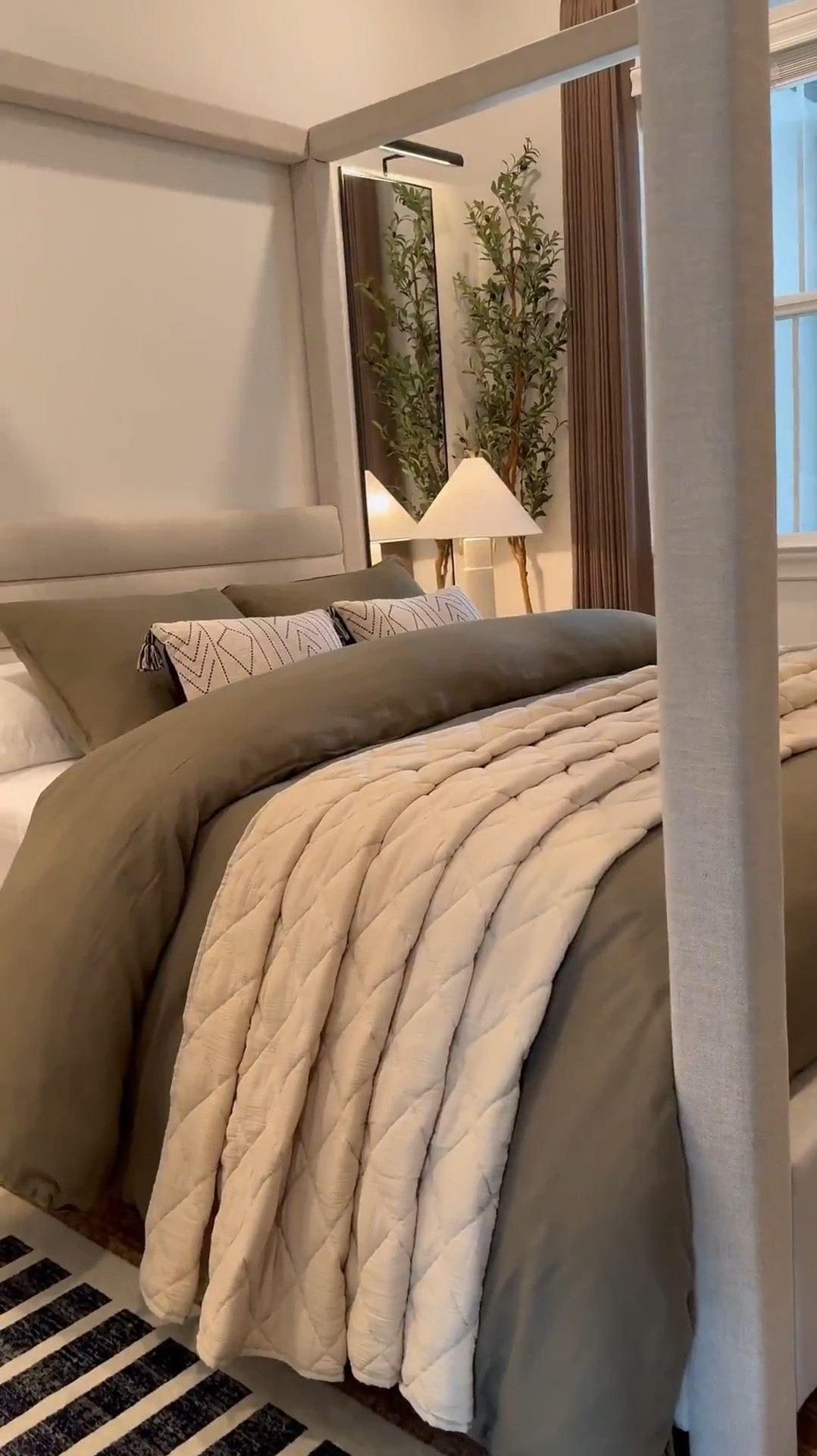 I used two duvet inserts to create that fluffy look.. plus i added a throw blanket under the rolled part! 🤎 Bed size is a Queen and the duvet+inserts are King size. I like sizing up on bedding bc it gives more fabric to work with especially if you want your bed to look full around! 😊

Measurements: 

Bed: Queen 

Duvet: King size - I inserted 2 King sized down inserts to give the bed a fuller look. Sheets & pillows are Queen sized 

Mirrors - 58" H x 18" W……mirrors will make your space feel larger as well as reflect light to other parts of the room! 

Drapes: Color Cafe Brown … Size 40"W x 108" W 

Sideboard in front of the bed was bought internationally but I linked a similar one below - Great price too!! 🤎

I used the “small table lamp” (linked) to create the glow effect behind the planter. I recommend  warm white light bulbs 😊

#LTKSaleAlert #LTKHome #LTKStyleTip