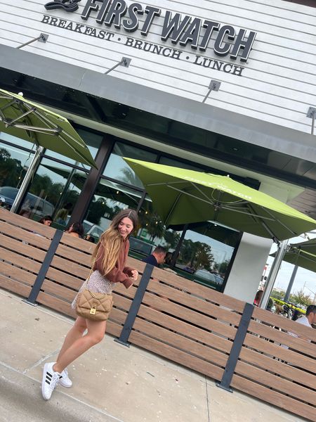 Brunch at First Watch, living for their Fall menu! That pumpkin pancake 🥞 wearing Sam’s club fleece hoodie in dark brown, so cozy for the colder days coming up. Loving this active skort and adidas sneakers. Linked similar steve madden crossbody bag. Perfect athletic look/ Athleisure outfit. Xoxo #LTKU #LTKHalloween #fall #falloutfits 

#LTKfindsunder50 #LTKfitness #LTKfindsunder100