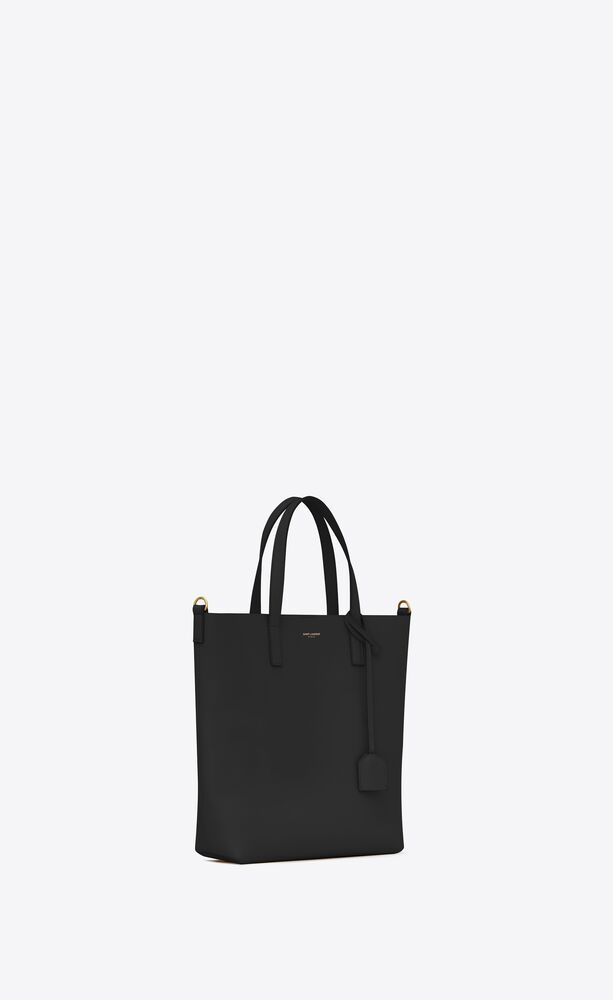 north/south bag with flat handles, with an adjustable and removable strap, snap-button closure, a... | Saint Laurent Inc. (Global)