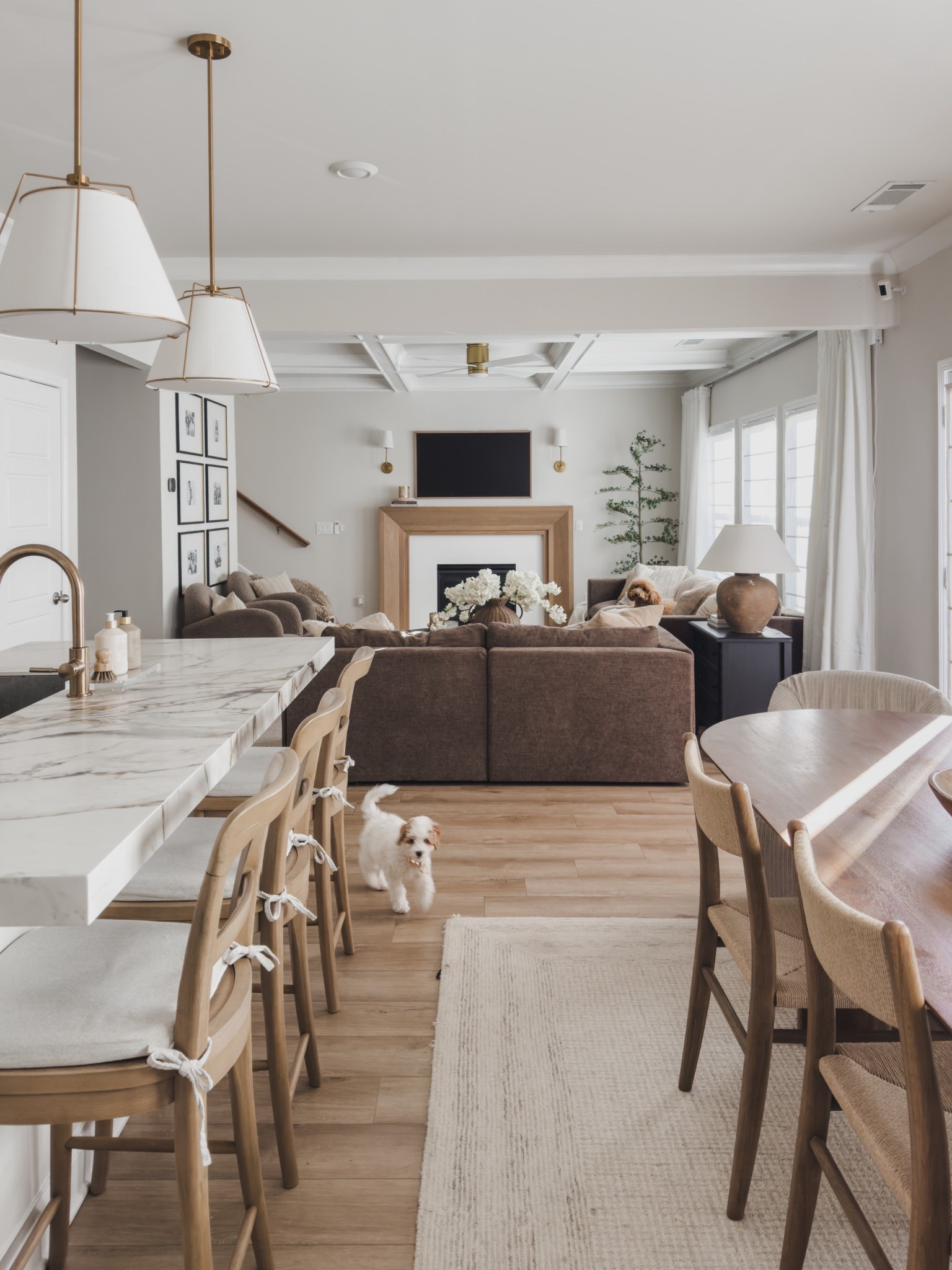 Sharing one of my favorite views of our open concept living area. This space really captures the balance I’m always aiming for— warm brown tones, creamy whites, and pieces that are just as functional as they are beautiful.

From using a nightstand as a side table (the storage is truly 10/10) to motorized curtains and shades that save us every evening when the sun starts pouring in —every choice was made with real life in mind. 

This is very much my current season: kids running through the house, dogs underfoot, and a home that needs to work hard while still feeling calm and pulled together.

Aesthetic and functional will always win around here!

#LTKHome #LTKSaleAlert #LTKFindsUnder100
