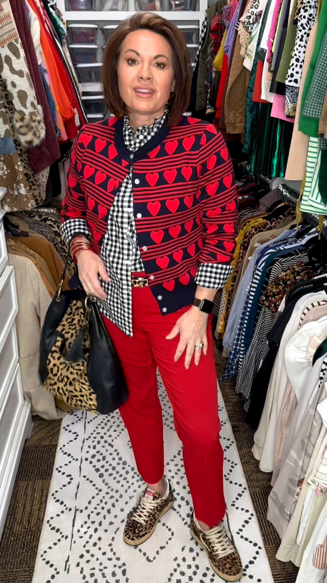 Playful classics made easy.

Heart-print cardigan layered over a black-and-white gingham shirt with tailored red ankle pants. Leopard sneakers add a fun twist, finished with a black shoulder bag and statement earrings — perfect for work, errands, or lunch out.

Shop the look:
heart cardigan • gingham button-down • red ankle pants • leopard sneakers • black shoulder bag • statement earrings

⸻

heart cardigan outfit, patterned cardigan women, gingham button-down outfit, red ankle pants women, leopard sneakers women, pattern mixing outfit, work-to-weekend outfit, polished casual style, fashion over 40, everyday chic outfit, elevated casual look, classic with a twist

#LTKFindsUnder50 #LTKootd #LTKgrwm