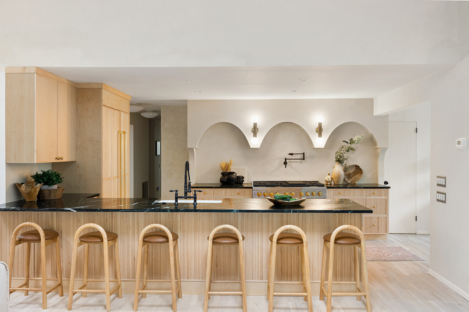How we got a kitchen that looks like $200K without actually spending $200K.

The biggest savings came from smart planning—keeping the plumbing where it was, using reeded cabinetry only in high-impact areas, finding discounted stock marble, and skipping island pendants.

We spent where it made the biggest visual impact: custom arch carpentry, paneled appliances, limewash, and marble counters.

Expensive-looking doesn't always mean expensive. It's about knowing where to spend and where to save.

Linking the exact and similar pieces here.

#LTKActive #LTKHome #LTKSaleAlert