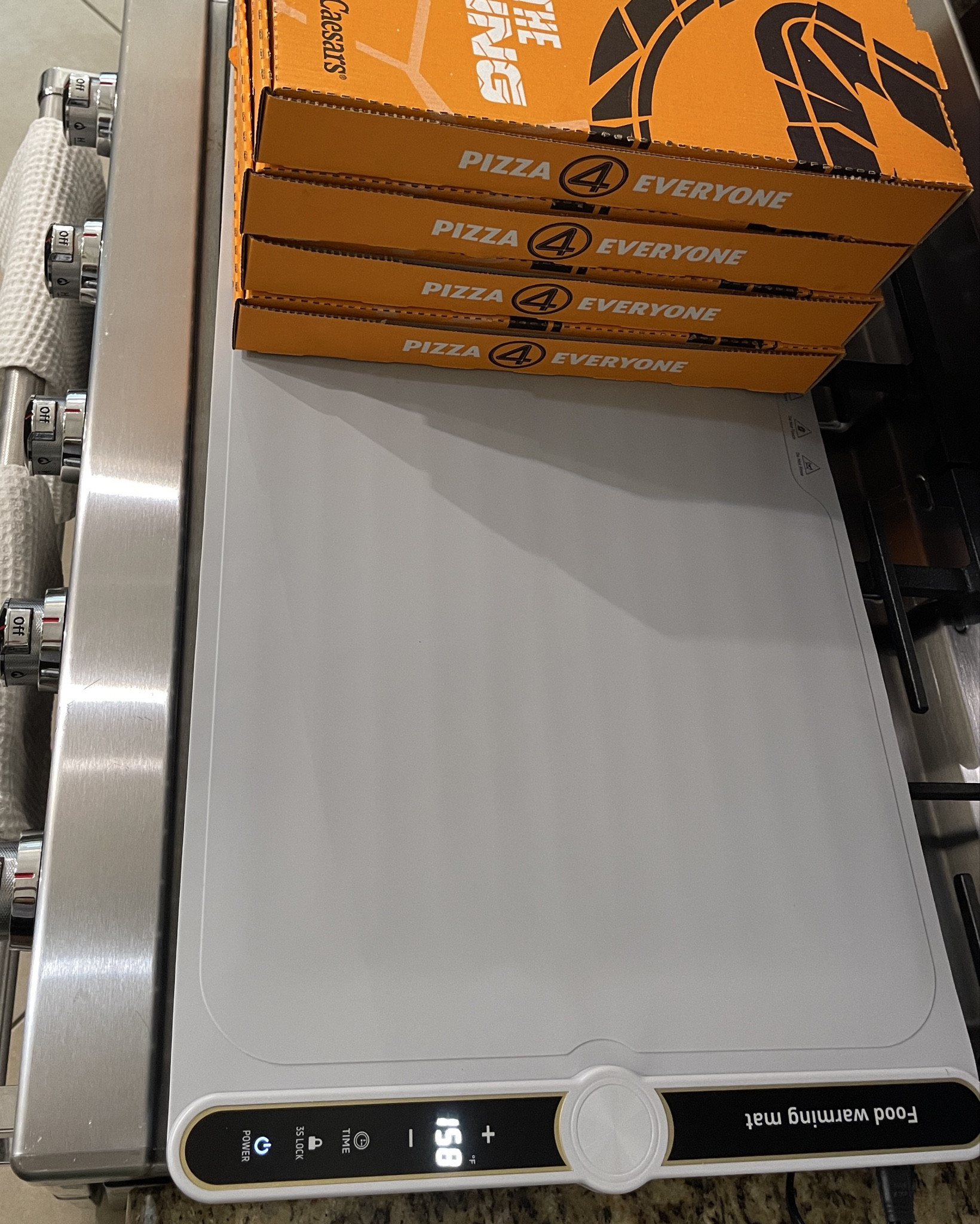 We had a kids get together over the weekend and pizza is a party food staple! Expecting guests to arrive at different times, I pulled out the food warming mat to set the pizza boxes on. The mat can be set on our granite kitchen counter or like for the party where I laid it across the stove. You can use it to keep foods at safe temperatures for guests to serve themselves. 

#LTKHome #LTKFindsUnder100 #LTKFamily