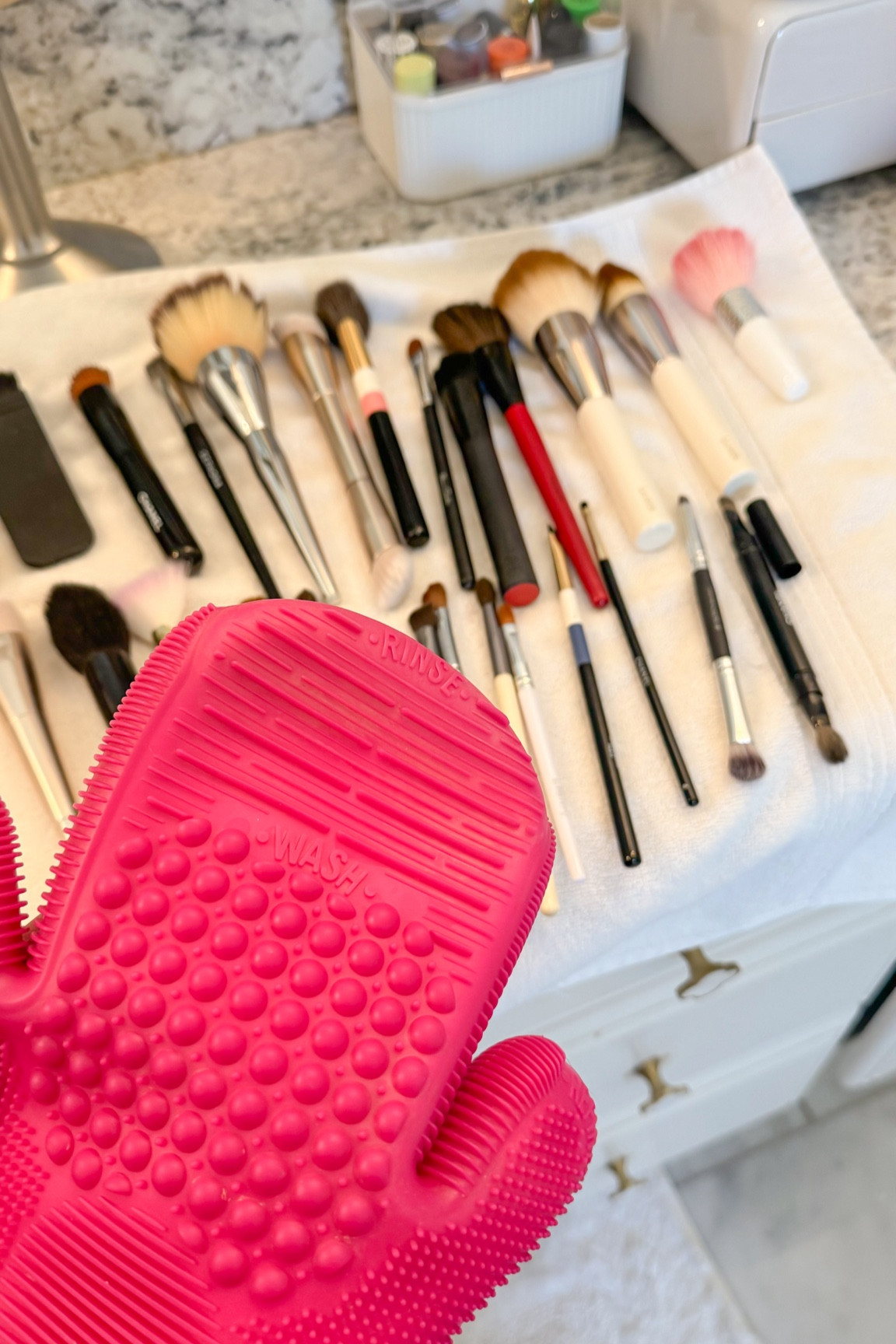 If you’ve never used one of these makeup brush cleaning mats/gloves, they are such a game changer! They don’t make this exact glove anymore, but I have the cleaning mats from the same brand with the same texture linked! I use baby shampoo or nontoxic dish soap to wash my brushes. I try to clean them once a month and wipe off with a baby wipe or spritz with a daily brush cleaner on a daily basis as I do my makeup. 

#LTKBeauty