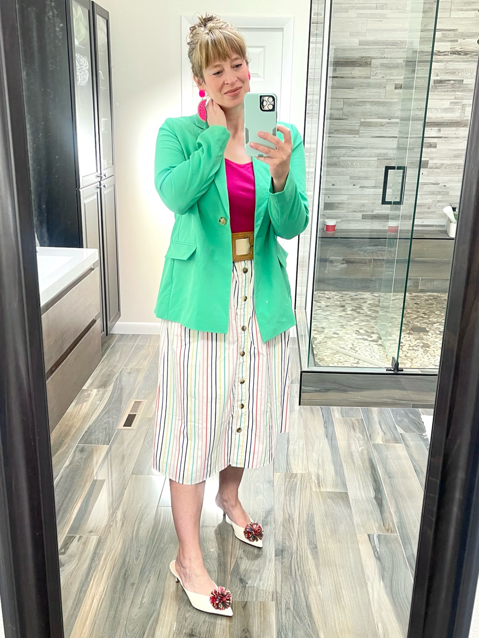 Pairing a pop of green blazer with a white rainbow stripe skirt and colorful mules. Woven raffia belt and a bright pink top tie it all together.

#LTKmidsize #LTKcurves #LTKworkwear