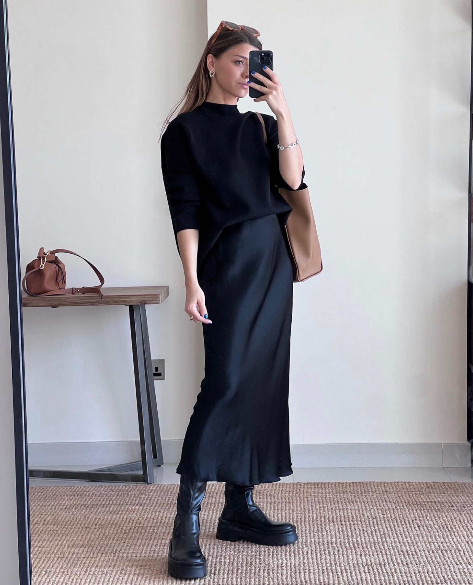 Black satin skirt, black jumper and platform shoes, brown tote bag.

#LTKunder100 #LTKSeasonal #LTKworkwear