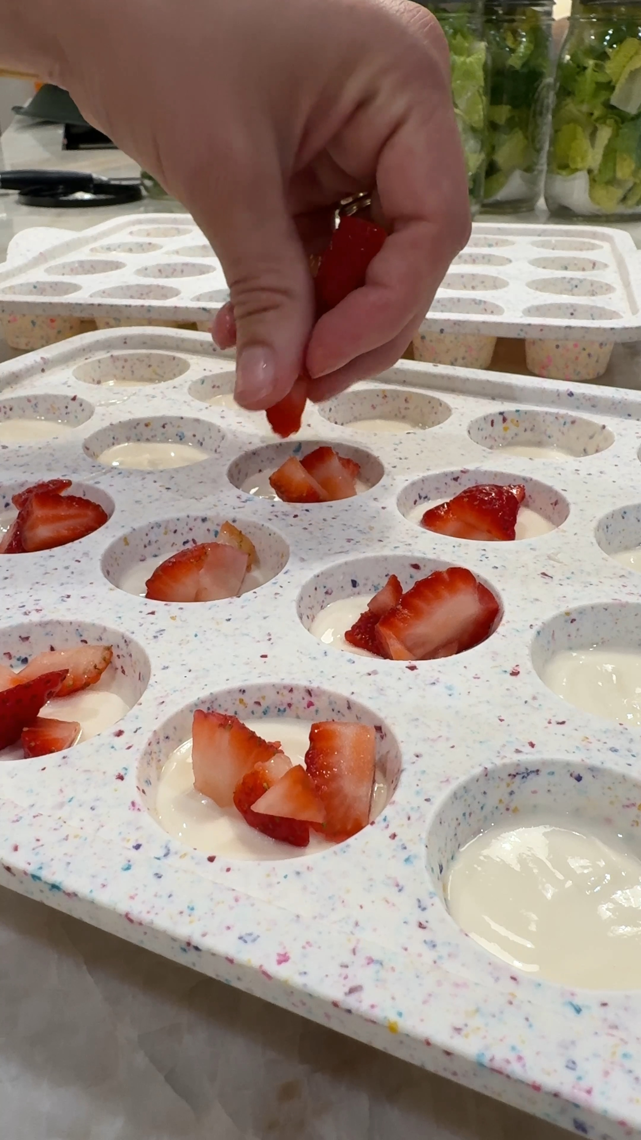 STEP 1::
Grab a mini muffin pan (I recommend a silicone one, but you can also use mini muffin liners if using a traditional mini muffin pan.
STEP 2::
Scoop 1 Tbsp greek yogurt into each muffin pan, then shake the pan to let any air bubbles escape & allow the top to smooth out. Then sprinkle your toppings on (I use chopped strawberries & mini chocolate chips).
STEP 3 :: Shake the muffin pan once more to allow everything to smooth out on top, and then pop into the freezer until fully frozen. Once frozen, remove from muffin pan & store in a freezer bag or air tight container store in the fridge. Pop them out whenever you want a sweet treat! (No need to thaw). ENJOY!!
**OPTIONAL: you can spread this out thin on a cookie sheet & sprinkle toppings, then freeze & break into "bark".
.. either way, it's good!

#LTKFamily #LTKVideo #LTKHome