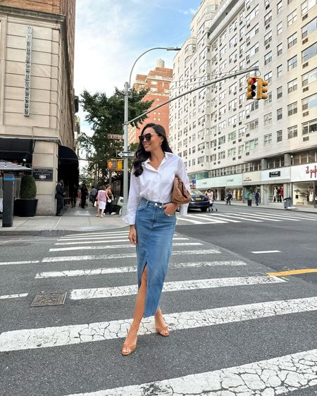 Kat Jamieson wears a denim skirt, white button down and suede kitten heel sandals in NYC. Fall outfit, fall transition, pre-fall, street style. 

#LTKSeasonal #LTKunder100 #LTKshoecrush