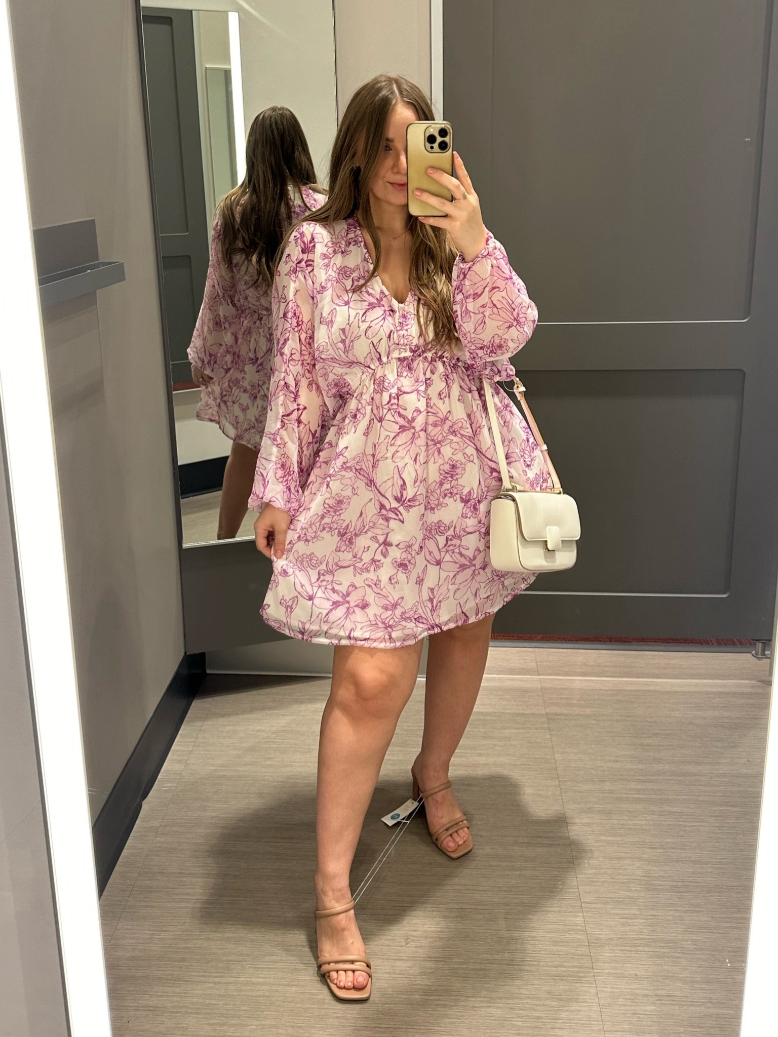 The perfect spring dress! Flowy, floral, affordable, and comfy 🌸 The sleeves are sheer so you could easily wear this piece into summer. Wearing the small here! 

#LTKfindsunder50