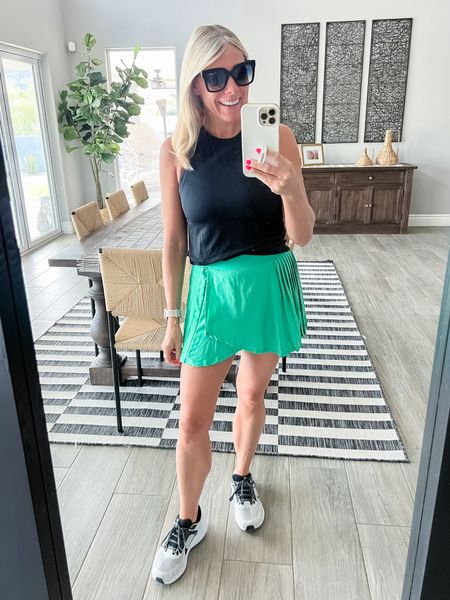 Love this green pleated skirt with a black tank top and Nike sneakers. Size small skirt and 8 sneakers. Skort activewear 

#LTKFitness #LTKActive #LTKSeasonal