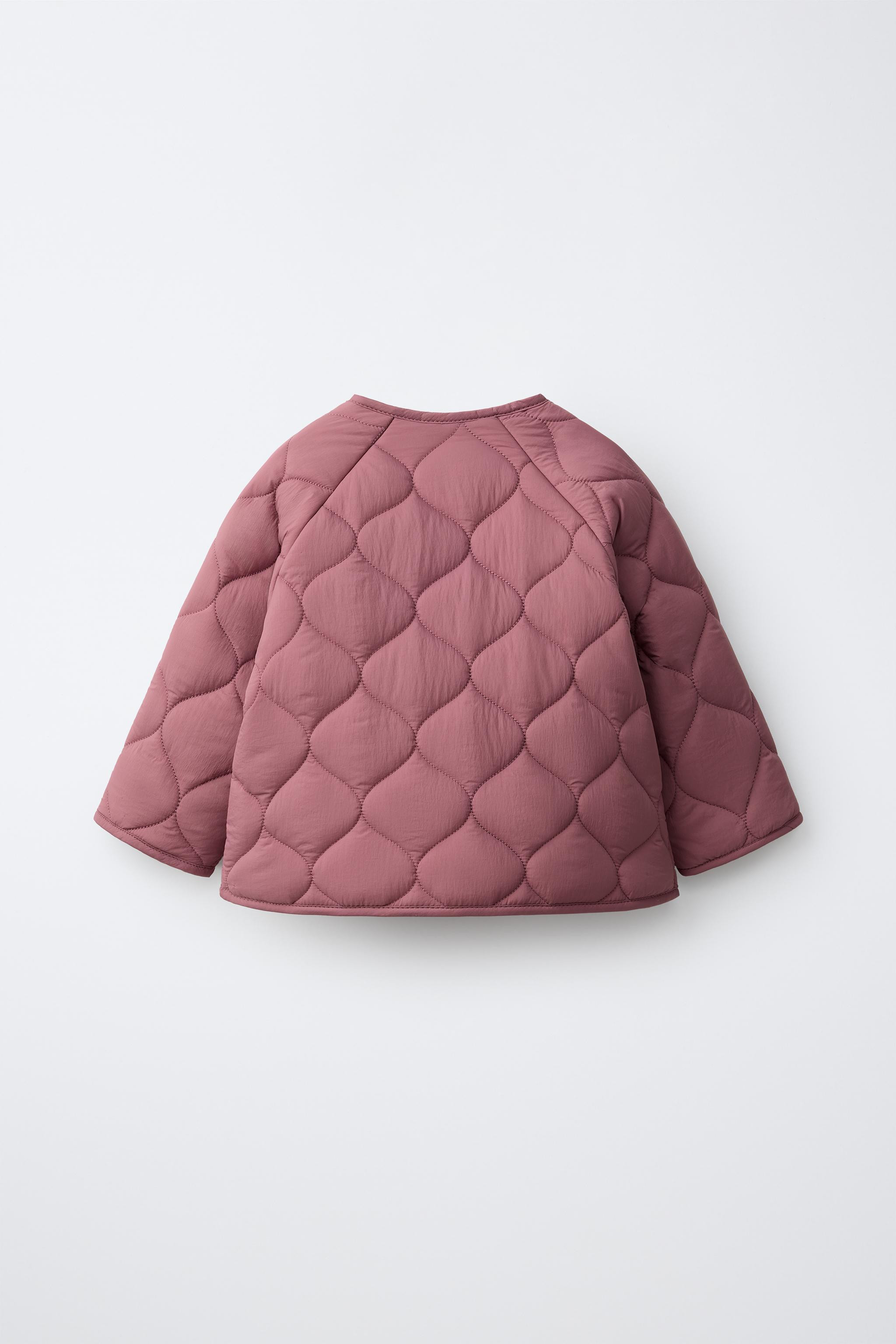 Water-repellent quilted jacket. Round neckline and long sleeves. Front snap button closure and he... | Zara US