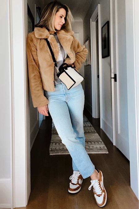 Easy outfit idea: styling a faux fur jacket. When I want to feel more human, I reach for jeans and this pair is amazing. They’re high rise and slightly cropped. If you’re in between sizes, I would size down.

Also, how cute is this mini handbag?? It’s so chic. Obsessed.

#LTKSeasonal #LTKitbag #LTKstyletip