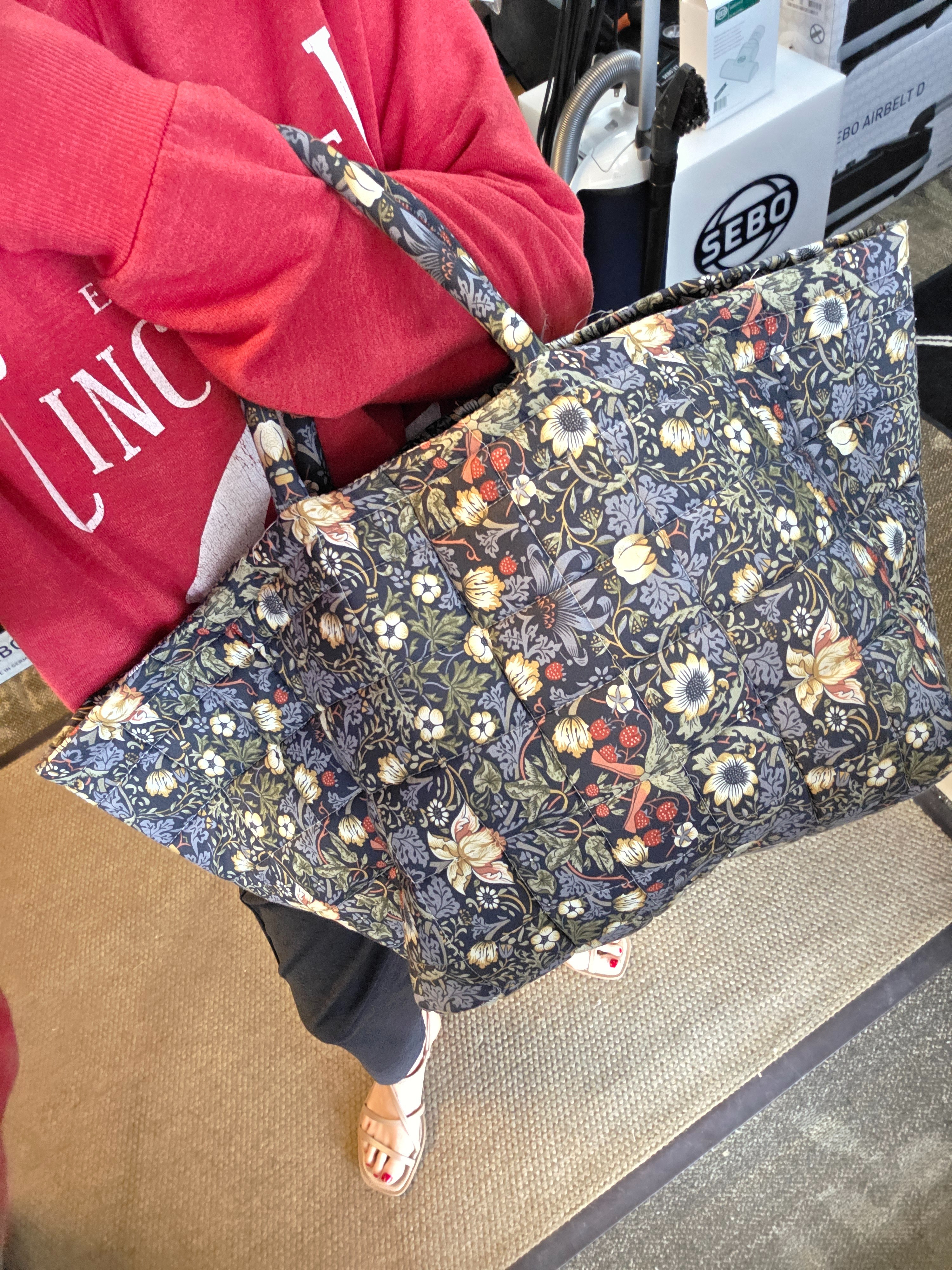 A cute tote you can pack to the gills or use as a handbag. My mom gifted these to us as a Christmas gift bag. Tons of patterns. Fill it for graduation or dorm so fun

#LTKMothersDay #LTKTravel #LTKselfcare
