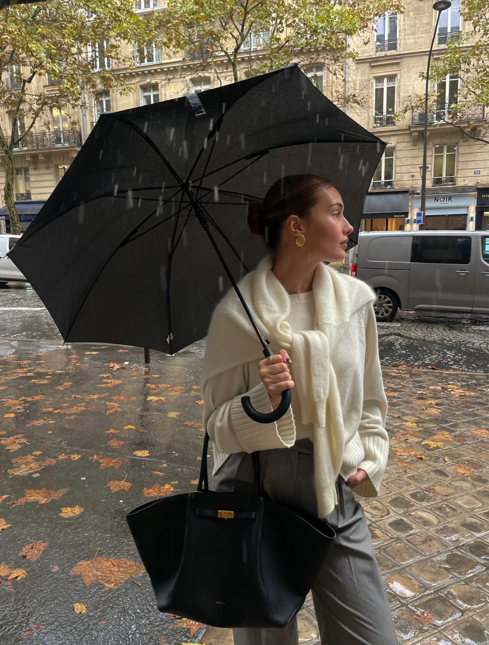 Paris outfit, rainy day outfit inspo, rainy outfit, cream jumper outfit, grey trousers outfit, black umbrella, heaven mayhem earrings, LilySilk jumper, tall grey trousers, ASOS, asos trousers, demellier bag, demellier New York 

#LTKautumn #LTKeurope