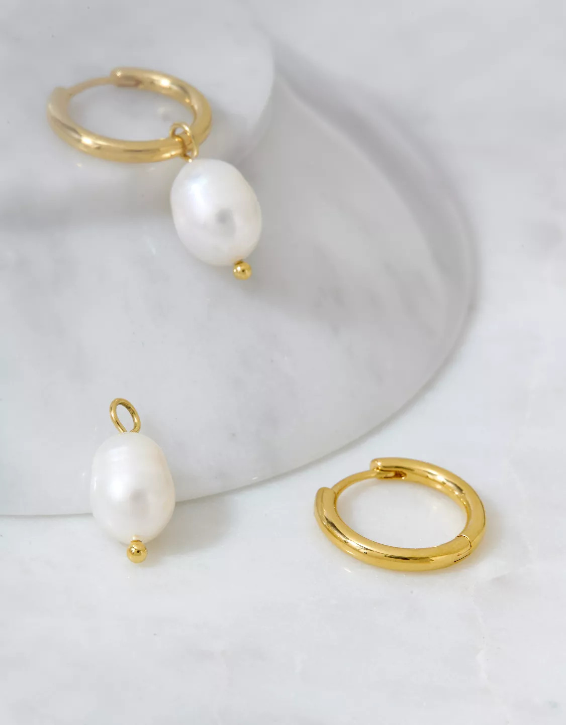 AEO Keepers Collection 14K Gold-Plated Pearl Huggie Earrings | American Eagle Outfitters (US & CA)