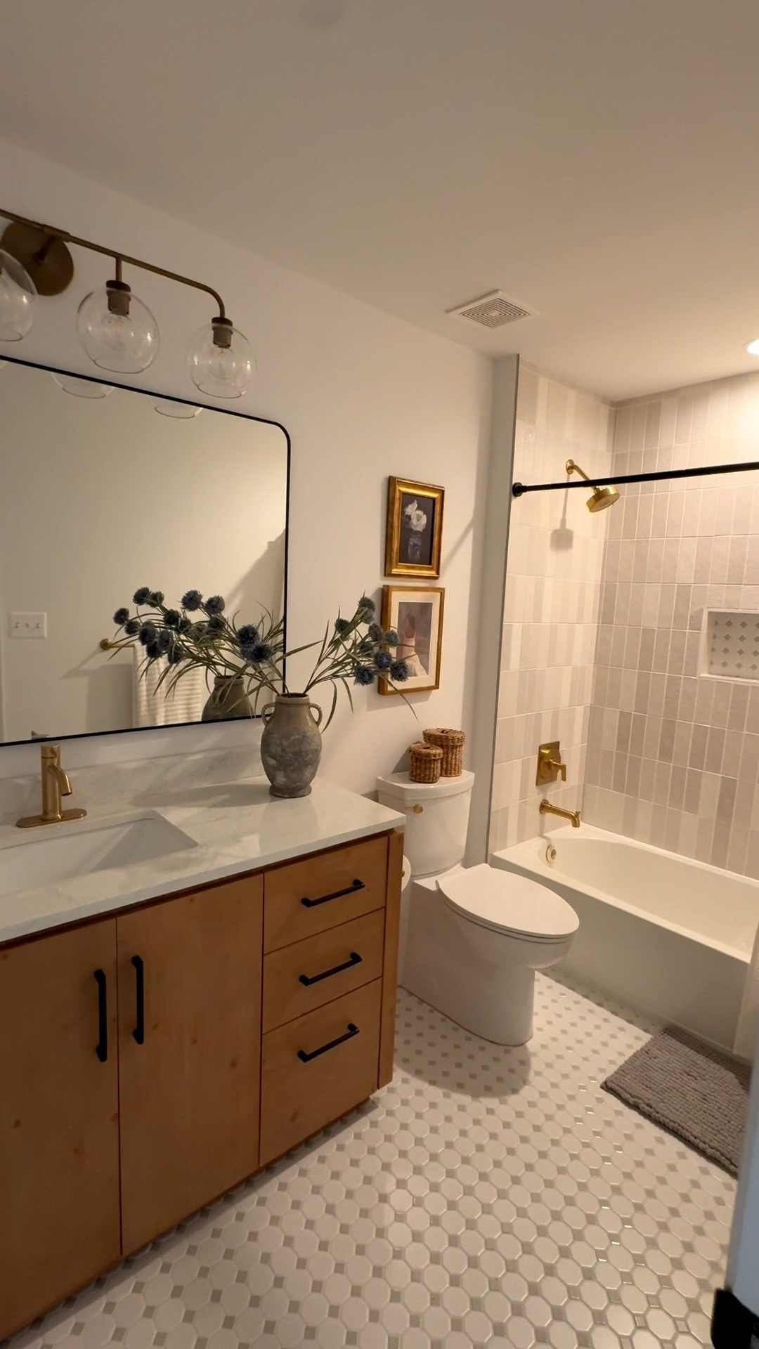 Neutral bathroom inspo 🤎 all details below 👇🏻 

Wall Paint: McCormick Super White, flat finish

Floor Tile: Octagonal Porcelain Mosaic Tile White & Grey from Mineral Tiles (linked similar)

Wall Tile: Zellige Pearl Opal Polished Ceramic Tile from Floor & Decor (linked similar)

Grout/Caulking: Artic White from The Home Depot (exact linked)

Vanity: San 60'' Single Bathroom Vanity with Cultured Marble Top in Fir Wood Brown from Wayfair (exact one linked)

Vanity Faucet: Ryden Single Hole Single-Handle Bathroom Faucet in Brushed Gold from The Home Depot (exact one linked)

Mirror: Forbath Large Bathroom Mirror 36 x 55 Inches from Amazon (exact one linked)

Vanity Light Fixture: Reagan Quadruple Globe Sconce from Pottery Barn (exact linked & on clearance) 

Bathroom Hardware (towels/toilet paper:) Chamberlain 3-Piece Bath Hardware Set with 24 in. Towel Bar, Toilet Paper Holder, Towel Ring in Champagne Bronze from The Home Depot (exact linked)

Shower Fixtures: Castia By Studio McGee Rite-Temp Bath And Shower Trim Kit 1.75 GPM in Vibrant Brushed Moderne Brass from The Home Depot (exact linked)

Toilet: American Standard Clean White Elongated Chair height Soft Close 2-piece Toilet 12-in Rough-In WaterSense 1.28 GPF from Lowes (exact linked)

Toilet handle: KOHLER 1034693-VF Replacement Part,Polished Brass from Amazon (exact linked)

Shower Rod: BRIOFOX Shower Curtain Rod Adjustable 18-78 Inch, Stainless Steel Spring Tension Shower Rod No Drilling Non Slip, Matte Black from Amazon (exact linked)

Decor & Accesories: linked everything that I could (frames are old from Target) 🤍


#LTKHome #LTKSeasonal