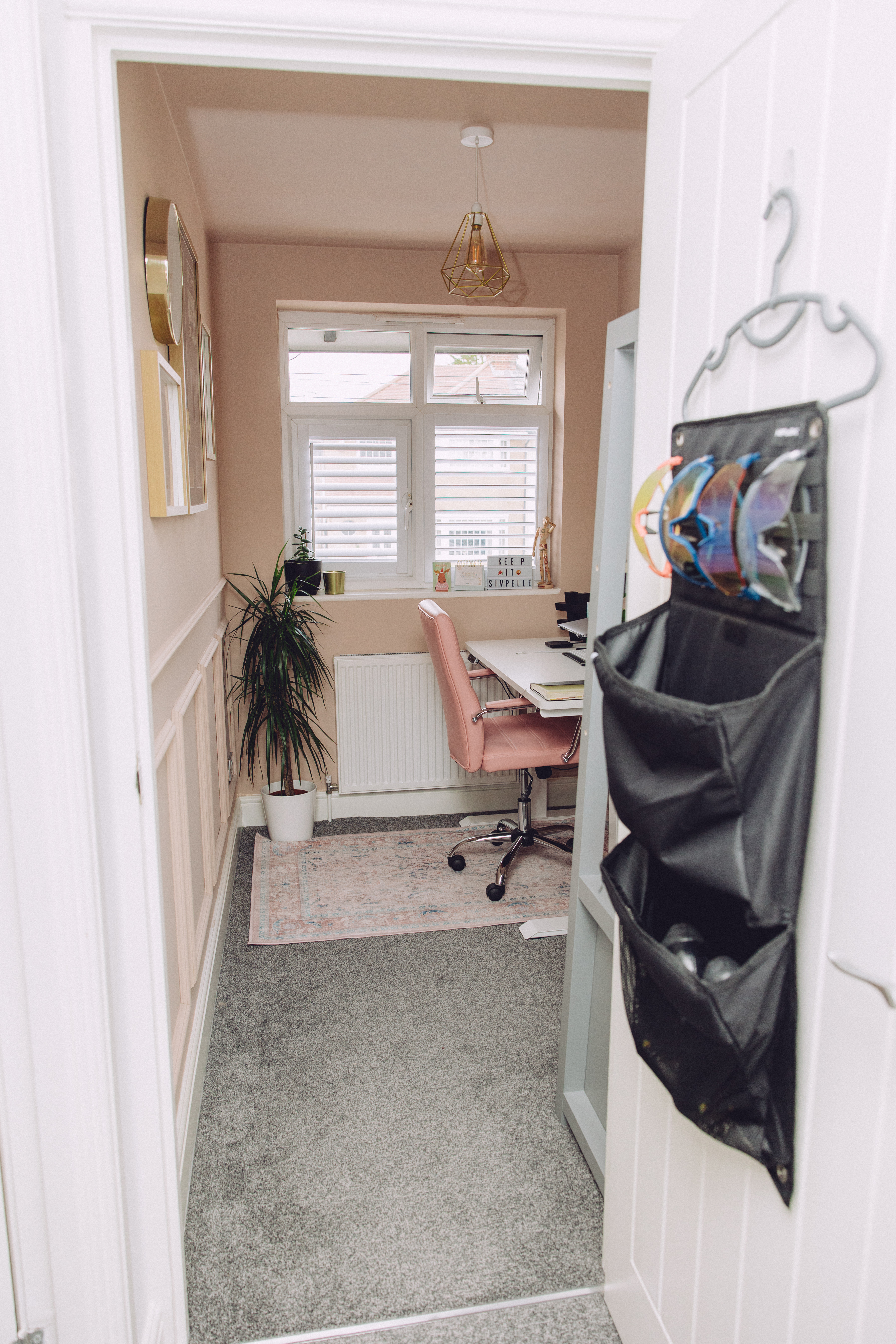 Home office, cycling storage, pink office, small office, gold accessories, gold bulb, gold clock, gold light shade, white desk

#LTKhome #LTKuk #LTKfitness