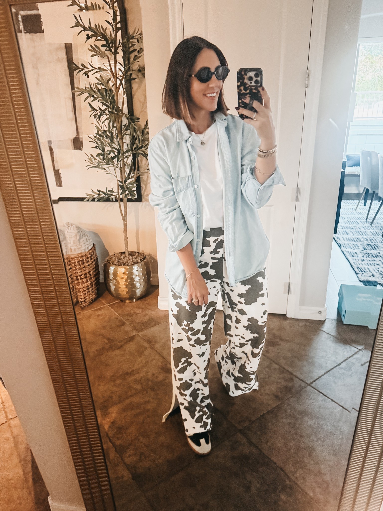 Cow print trend! 🐄 these wide leg track sweatpants are so cute!!  

- pants - Wearing size small. 
- $8 tee - small
- denim shirt - medium 

#Travelstyle #westernstyle #countryoutfit #target #targetstyle 

#LTKSaleAlert #LTKFindsUnder50 #LTKOver40