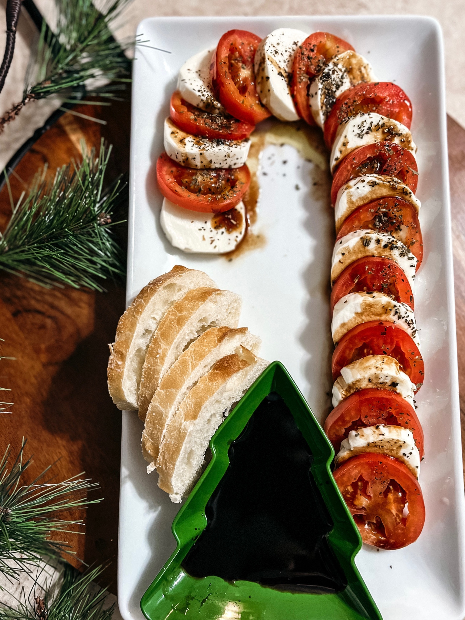Easy holiday salad/dish ❤️Just arrange tomato slices & mozzarella in the shape of a candy cane. Drizzle with olive oil, balsamic glaze, kosher salt, and pepper👌🏻 Thought this $3 tree dish was the perfect touch 🎄 

#holidayparty



#LTKSeasonal #LTKunder100 #LTKhome