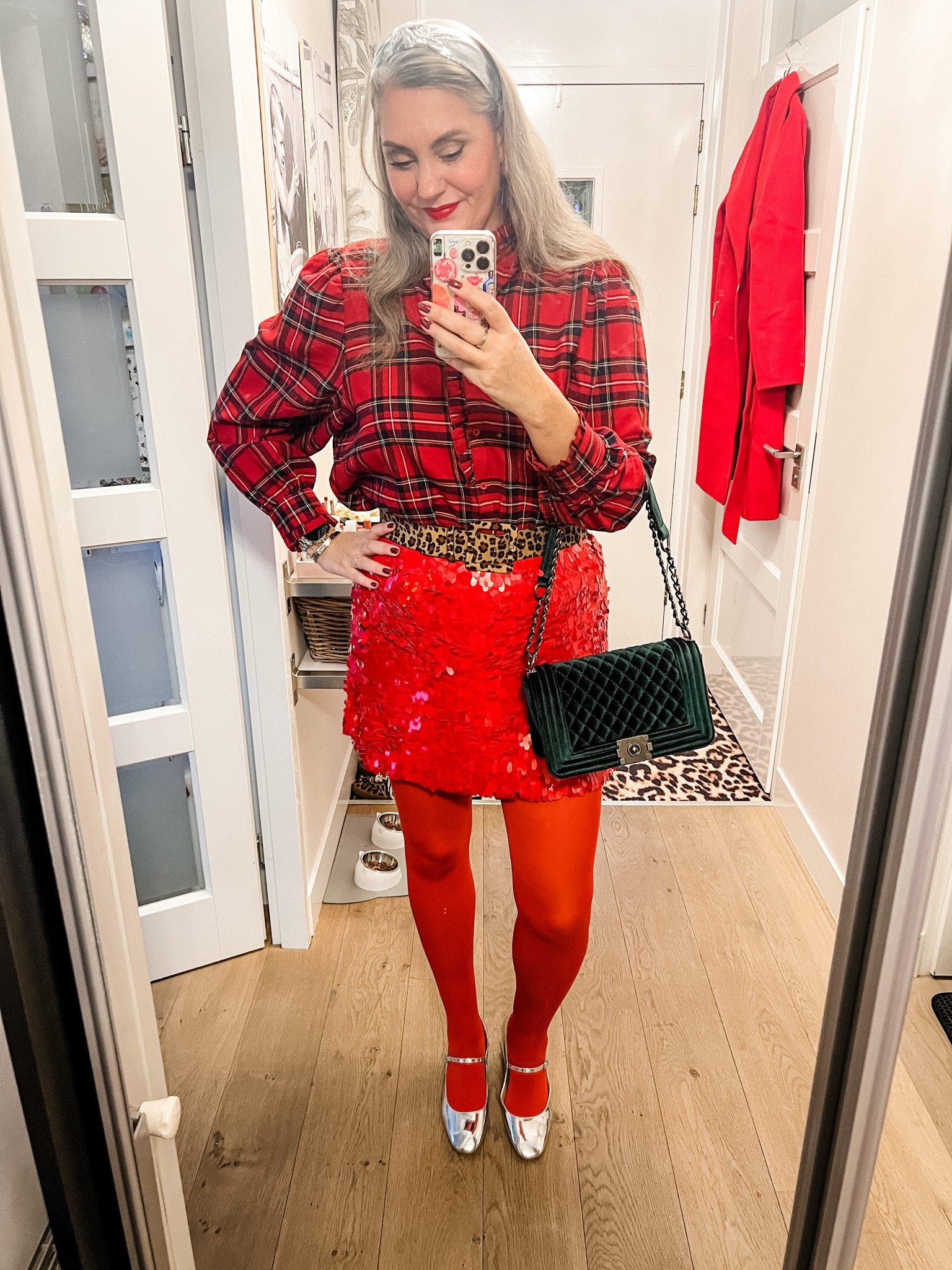 Ootd - Wednesday. Christmas Day 🎄
Red plaid blouse with balloon sleeves and a ruffle trim, red sequin mini skirt, red tights (Snag), leopard belt, silver Mary Jane shoes with stacked heel, silver headband, red midi coat, green velvet bag. 

#LTKnederlands #LTKeurope #LTKpartywear