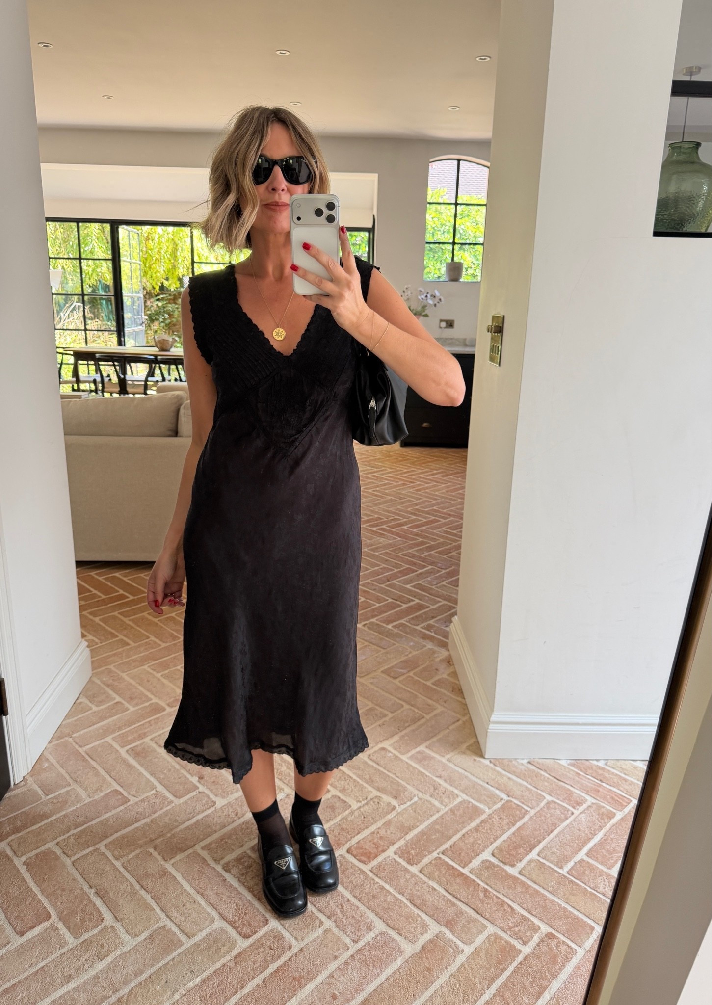 black satin midi dress, lace trim slip dress, v neck satin dress, scalloped hem dress, black loafers, Prada loafers, sheer black socks, gold pendant necklace, layered gold jewelry, black leather shoulder bag, black sunglasses, transitional dressing, autumn dress outfit, quiet luxury, elevated basics, effortless chic, minimalist off duty look, ltkstyletip, ltkseasonal, ltkfindsunder100, outfit inspo, capsule wardrobe essentials

#LTKsummer #LTKpartywear #LTKdresses