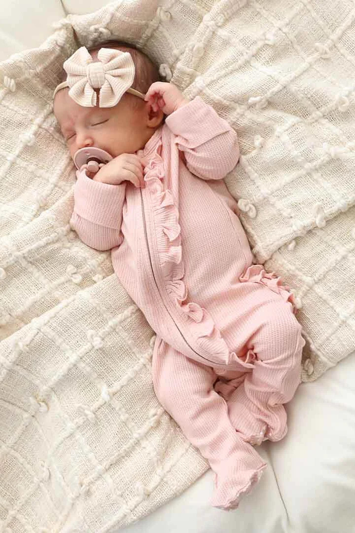 Lovely Pink Waffle Bamboo Zipper Ruffle Footie | Caden Lane