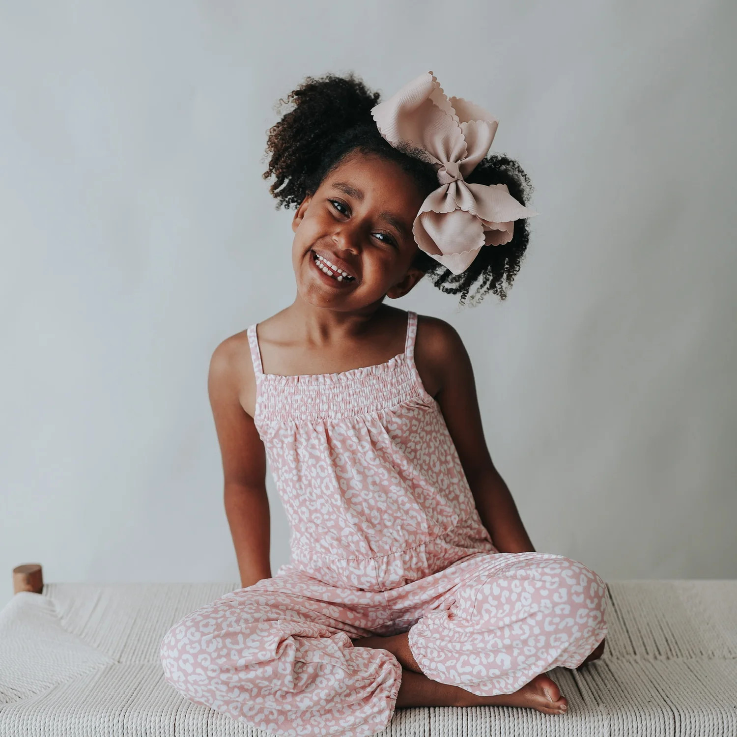 BLUSHING LEOPARD DREAM SMOCKED JUMPSUIT | Dream Big Little Co.