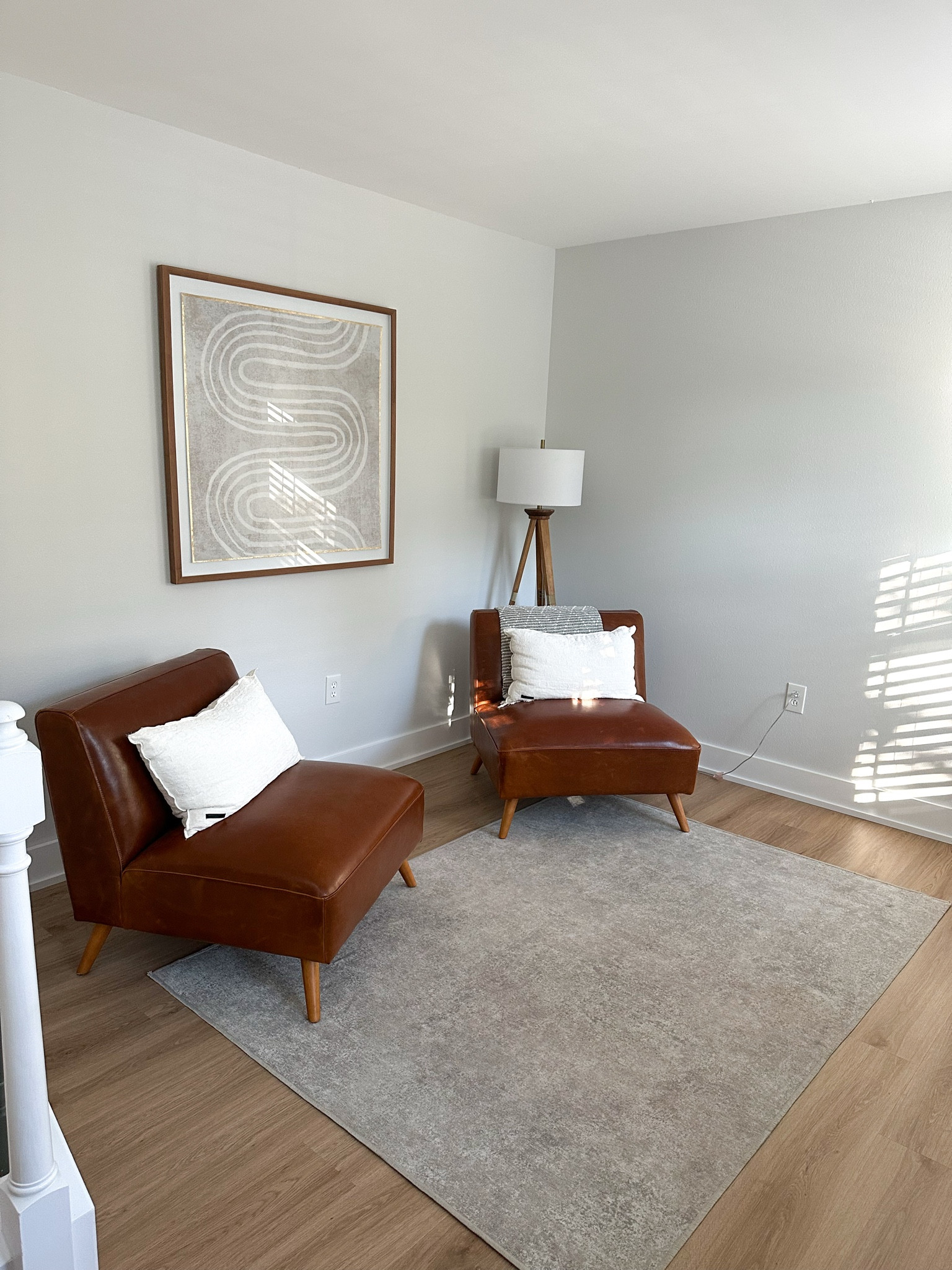 World Market Huxley cognac mid century modern armless chair 

Target Threshold oak wood tripod floor lamp dark brown

Ruggable Serenta ash grey area rug in 5x7. Definitely need a bigger and lighter rug for this room and more decor🙈

Abstract wall art, wall decor, modern accent chairs, area rug, home decor 

#LTKStyleTip #LTKHome