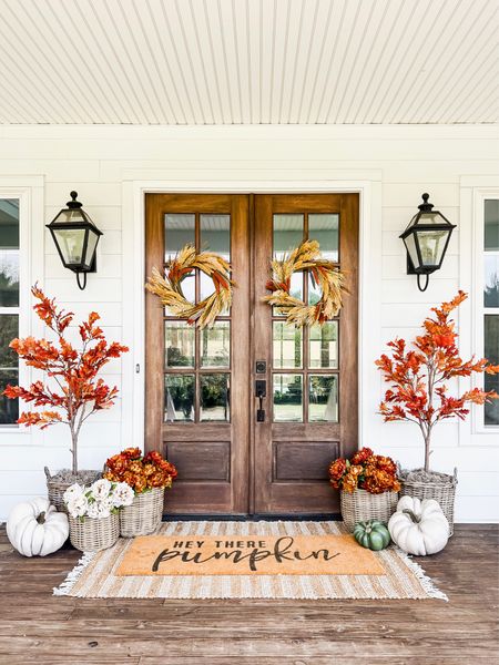 Front porch and door decor fall autumn harvest seasonal entry French double doors oversized layered scatter rug and doormat pumpkin magnolia trees faux artificial silk florals mums baskets wreaths outdoor lanterns wall sconces rocking chairs light fixtures southern modern farmhouse style home decor nearly natural amazon finds Etsy wayfair marshalls TJ Maxx home goods Walmart autumn oak trees 

#LTKhome #LTKHalloween #LTKSeasonal