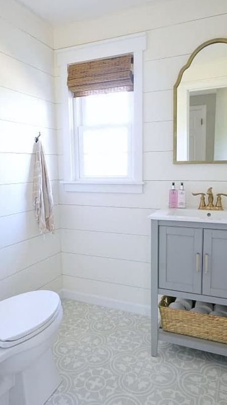 Powder bathroom with gray cabinet, pattern gray tiles, brass fixtures, shiplap, wicker shades, and more coastal style home decor

#LTKhome #LTKfamily