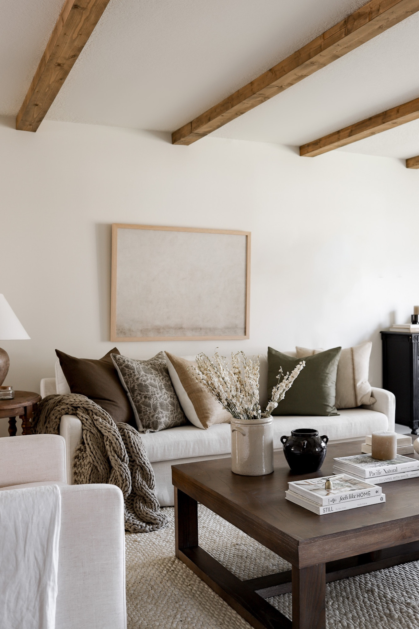 Shop our neutral living room, ivory slipcover sofa, throw pillows, and fall decor! I’m loving these dried florals for the upcoming season. The art print is the 40x30” mounted canvas from collectionprints.com 

#LTKSeasonal #LTKsalealert #LTKhome