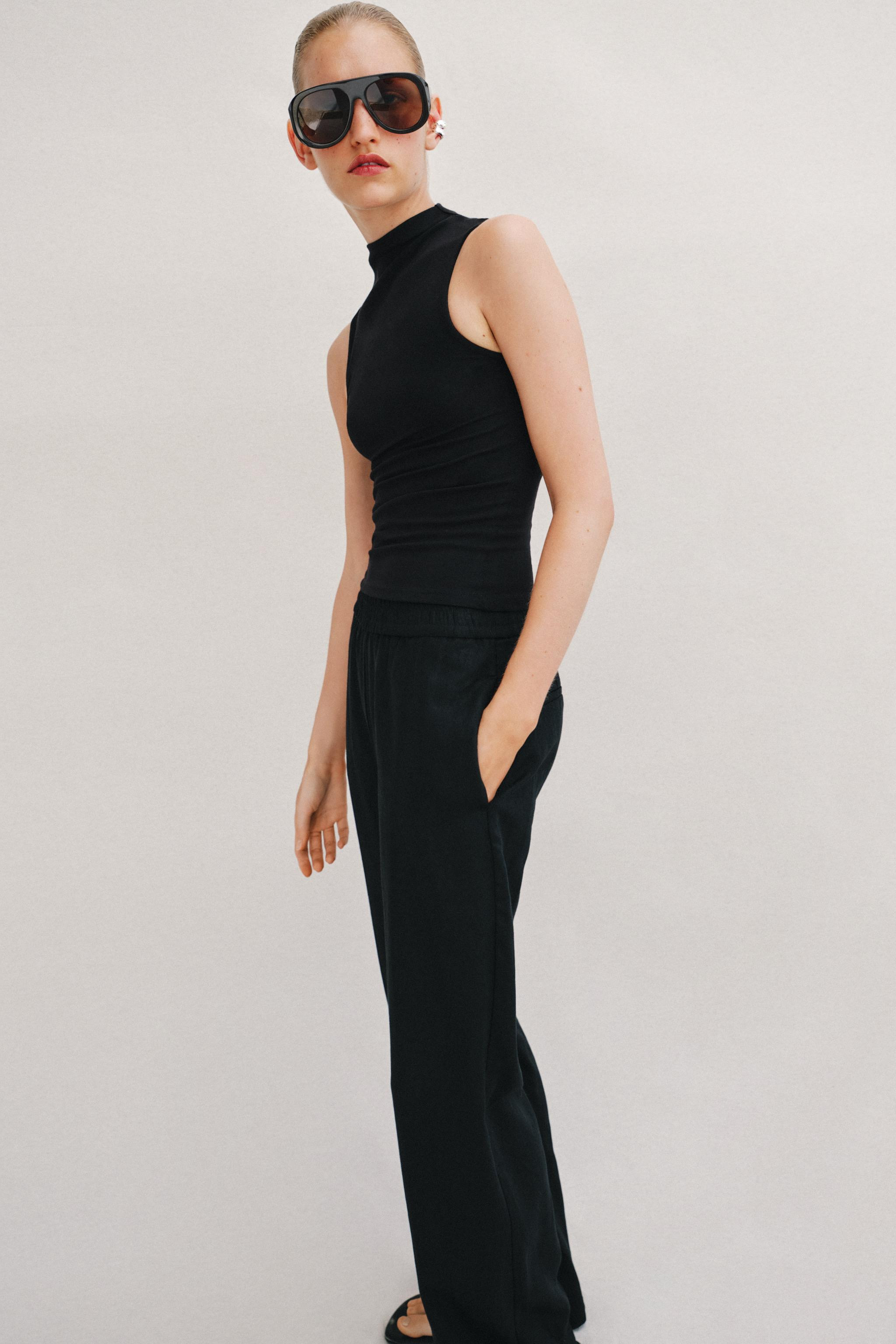 DescriptionColorContentsMeasurementsTop made from cotton yarn. Mock neck and sleeveless. Straight... | Zara US