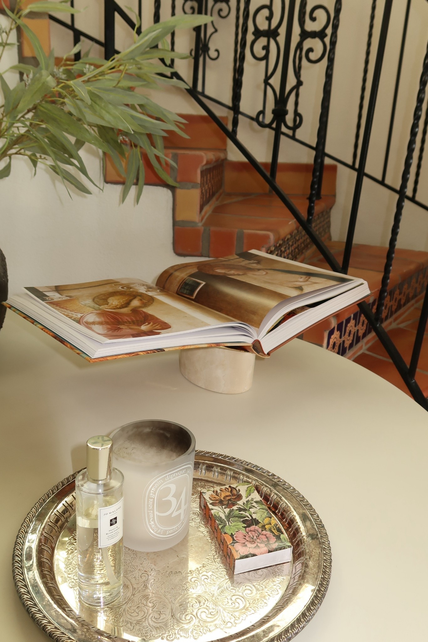 Entry table design! Found this book display and had to have it! The travertine touch is perfection. Also another one of my favorite candles. Smells heavenly!!! #entrytable #entrancetable #entrydesign #bookdisplay #booktray 

#LTKmomlife #LTKdayinmylife #LTKHome