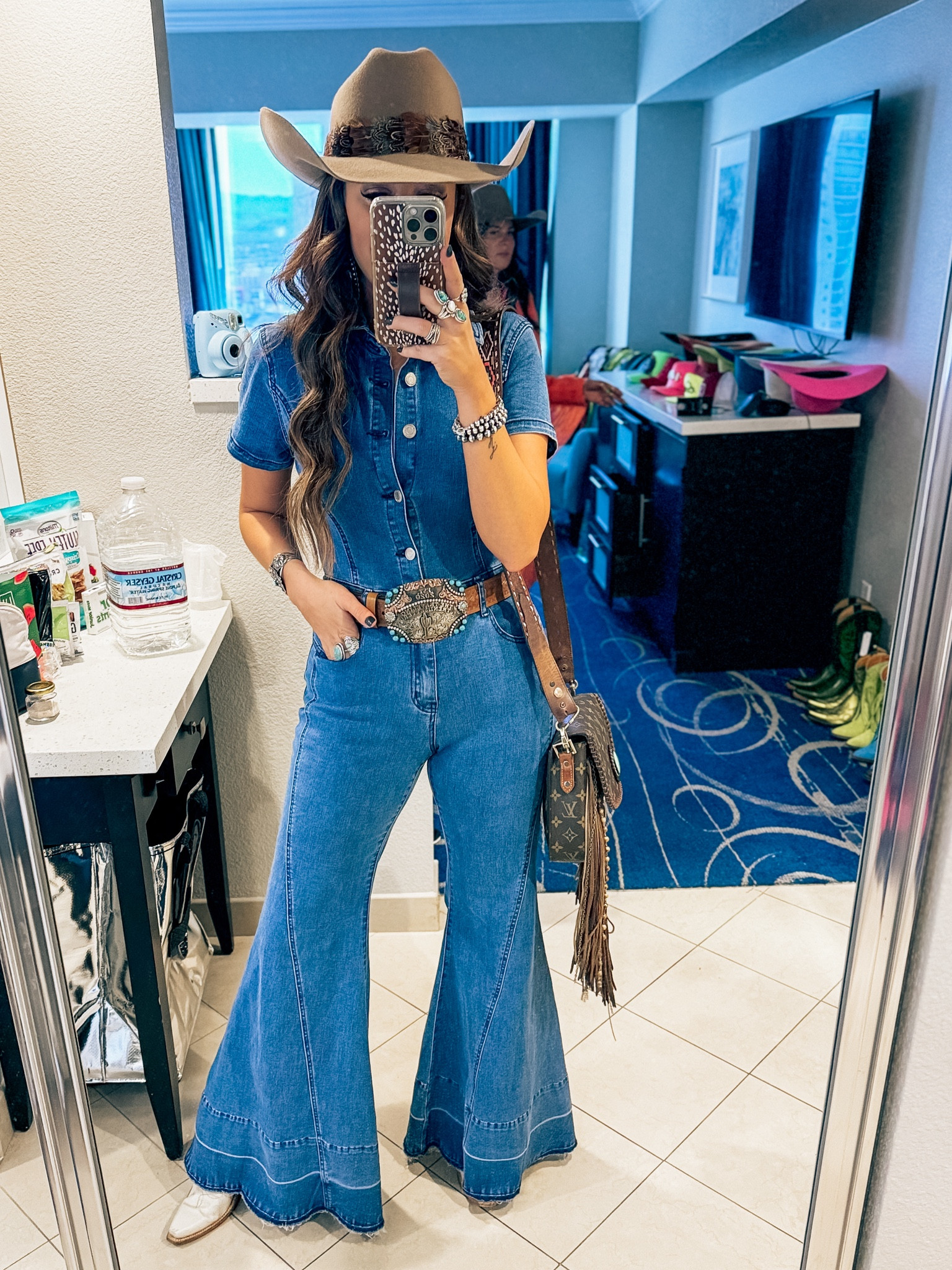 Denim jumpsuit - NFR fashion - outfit ideas - Vegas rodeo western country concert - denim on denim cowgirl hat - cowboy boots belt buckle fringe date night 

#LTKStyleTip #LTKFindsUnder50 #LTKFindsUnder100