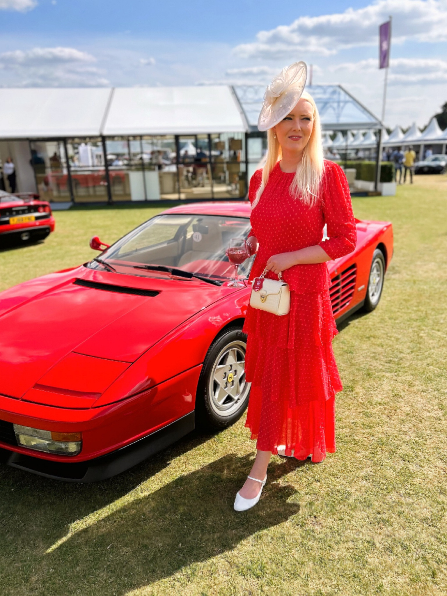 Ferrari Red at Salon Privé Style Friday Presented by Boodles - wearing the fabulous Poppy Red Poinsettia Tiered Dress by LK Bennett, partnered with their Ayla Cream Fascinator and Julie Drop Earrings. Don’t forget to use my 15% discount code on all full price styles at LK Bennett: REBECCALIPKINAUTHOR15 

Other accessories include the Aspinal London Mini Mayfair top handle bag in Ivory croc, Cream Mary Janes by Augusta and a Pearl Bracelet by Hobbs London

#LTKeurope #LTKuk #LTKluxury
