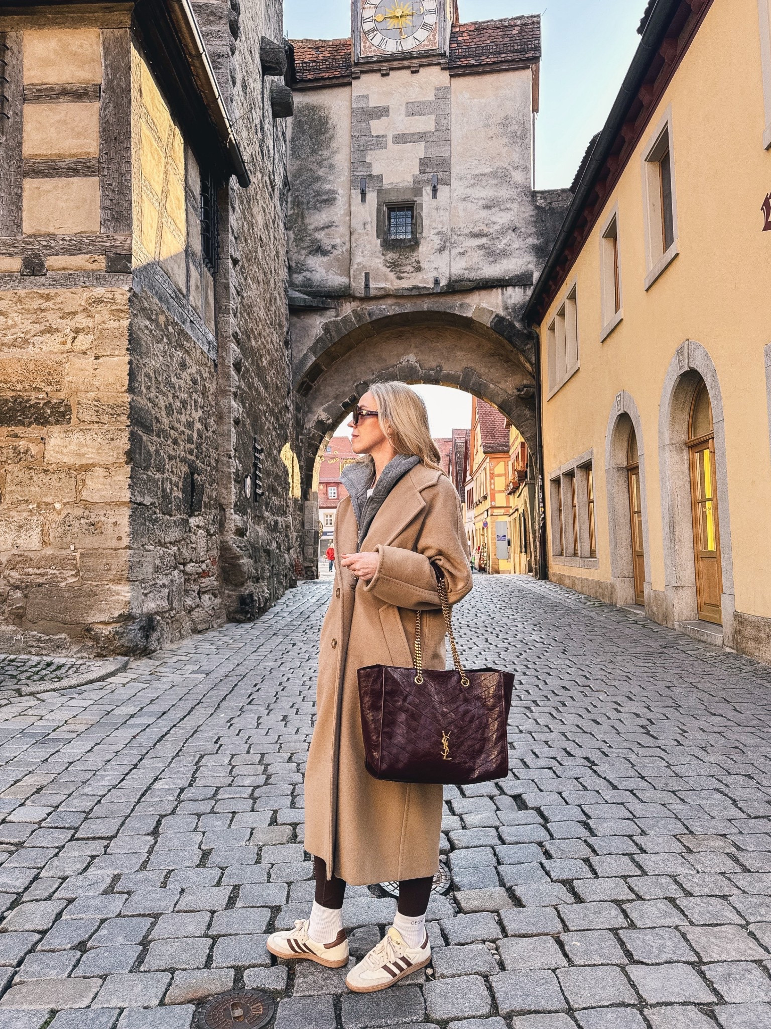 Spring travel look, European vacation style, Max Mara camel coat, chocolate brown leggings, Adidas Samba sneakers, burgundy YSL tote bag

#LTKSeasonal #LTKOver40 #LTKTravel