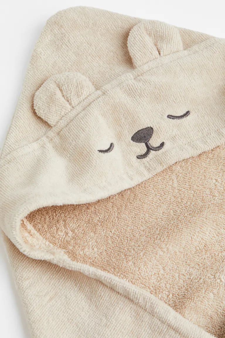 Conscious choice  BabyNew ArrivalWrap your freshly bathed treasure in this towel made from soft, ... | H&M (US)